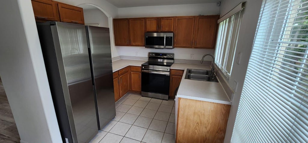 Photo of 2840 Osprey Cove Place #201, Kissimmee, FL 34746 (MLS # O6451117)