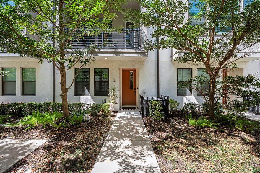 Come see this gorgeous David Weekley townhome in the center of the West Shore Business District's vibrant community. Strategically located in Westshore Village near front of the complex, this beautiful unit is just minutes from plenty of restaurants, like Cooper's Hawk, Del Frisco, Eddie V's, Texas de Brazil, Kona Grill and Miller's Ale House. It is a short hop across Boy Scout to International Plaza and Bay Street with its amazing shops and restaurants. Raymond James Stadium is very convenient as well. This modern townhome features 3 bedrooms and 3 and half baths with high-end designer finishes. As you enter the home you will notice the soaring ceilings  which enhance the natural light brought in by the hurricane rated impact windows. There is one bedroom and bath is downstairs with accent wall along with an oversized two-car garage. Added ceiling storage racks. On the second floor there is an open concept living and dining room and a chefs dream kitchen perfect for entertaining. Upgraded quartz counters, designer back splash and stainless steel appliance package including a natural gas stove . The dining room features a dramatic washed brick wall along with storage. The living room has beautiful upgraded crown molding, beamed ceilings, striking chandelier, window treatments and engineered laminate flooring. The living room opens to a balcony overlooking the courtyard, a perfect place to enjoy morning coffee or after work beverages. On the third floor is a spacious master bedroom suite with glass shower and walk in closet. There is also a third bedroom with its own en suite bathroom. The locale is within walking distance of a range of amenities including restaurants and bars. Don’t miss out on this great opportunity to own a piece of Tampa's vibrant community.