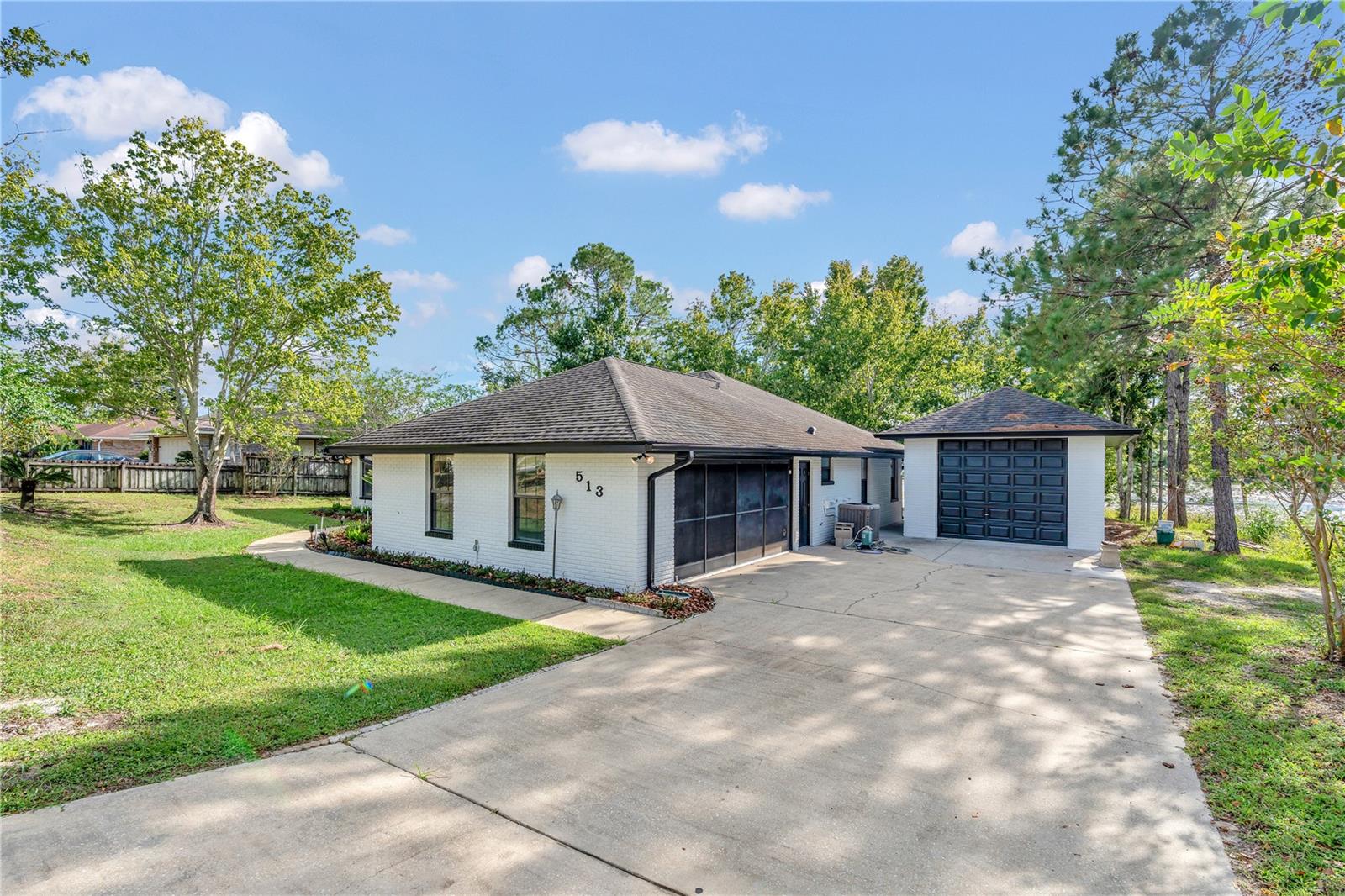 This beautifully renovated 3-bedroom, 2-bathroom home offers over 2k square feet of thoughtfully designed living space—all on a generous lot that invites both comfort and room to roam. Featuring a split floorplan and high ceilings, this house brings both function and a sense of openness to everyday life. Recently updated with luxury vinyl flooring and fresh paint inside and out, it offers a move-in-ready experience.
The heart of the home delivers striking lake views that add a tranquil backdrop to your daily routine. Whether you’re sipping morning coffee on the patio or hosting weekend get-togethers, the outdoor space sets the perfect scene. The property doesn't just offer curb appeal—it has muscle too, with a stand-alone oversized garage that’s ideal for everything from workshop dreams to serious toy storage.
Parking will never be a problem, and the solid quality of the build offers peace of mind for years to come. The home’s price point makes it an appealing option whether you're upsizing, downsizing, or rightsizing.
Conveniently situated within a short drive to New Smyrna Beach and the Orlando Metro area, adventure and amenities are always within reach. Daily errands are a breeze with grocery stores like Super Key Food nearby, while nature enthusiasts will enjoy the proximity to Manny Rodriguez Park. Education and transit needs are covered, too, with Pine Ridge High School and public transportation options just a short commute away.
Don’t let someone else fall in love with your next home—schedule your visit today. Buyer is to independently verify all measurements and information provided in this listing. Information is deemed accurate but is not guaranteed.