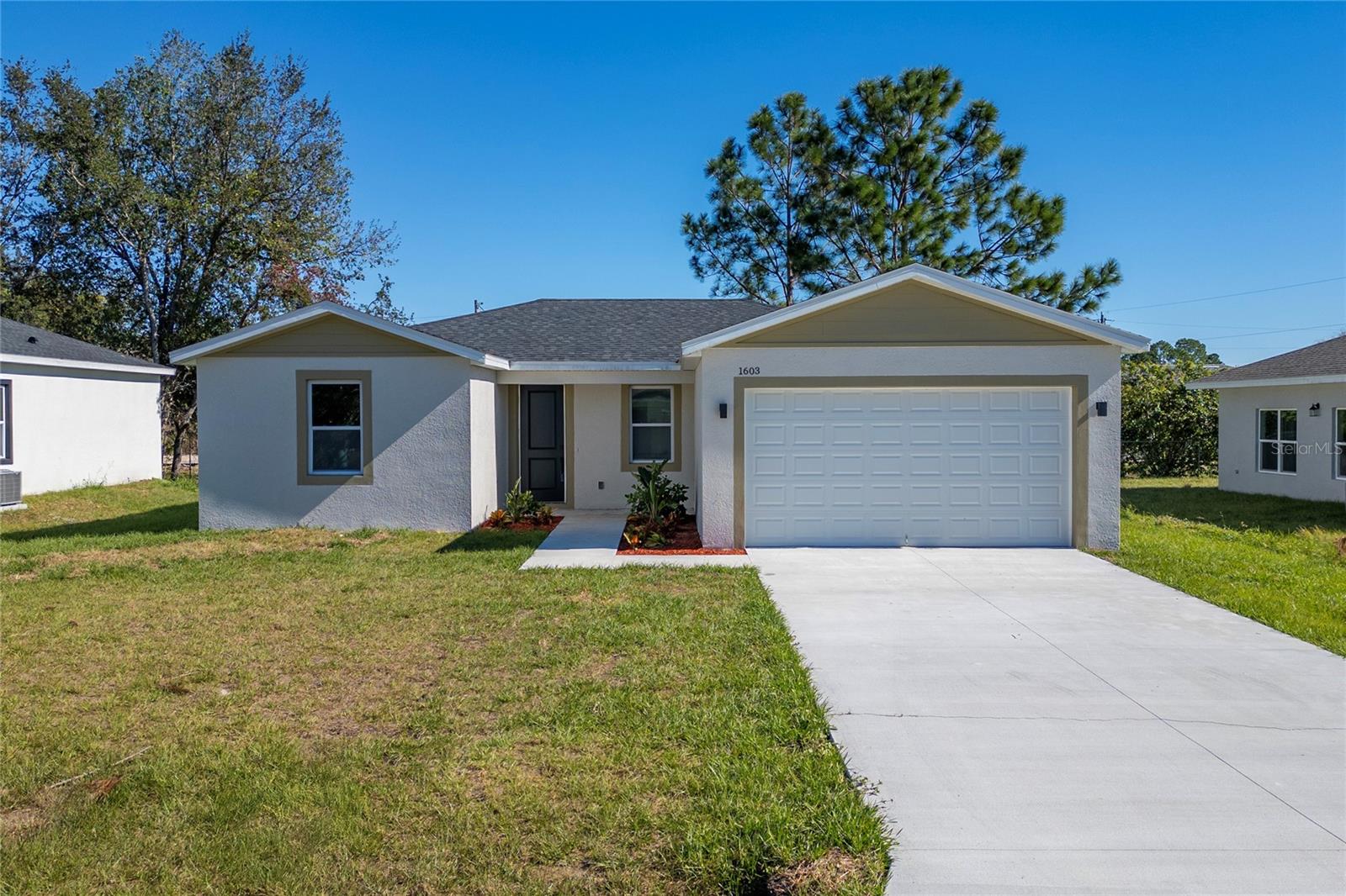 One or more photo(s) has been virtually staged. Your dream home in Poinciana awaits! Discover this open-concept property that offers inviting, light-filled spaces. The kitchen is a true gem, equipped with a spectacular backsplash, quartz countertops, a stainless steel sink, and 42-inch cabinets with modern designer hardware. With new stainless steel appliances, cooking and entertaining will be an exceptional experience. Elegant ceramic flooring extends throughout the home, while the bathrooms are designed with attention to detail, combining comfort and style at every turn. The master suite includes a beautiful shower, offering a luxurious retreat within your home. Enjoy your morning coffee on the inviting front porch or welcome your neighbors in a warm and friendly atmosphere. The back porch provides you with a pleasant space, and the spacious patio is perfect for outdoor dinners and memorable barbecues. The Poinciana Villages Association offers an authentic Florida vacation lifestyle with incredible amenities including community pools, a park with basketball courts, baseball and soccer fields, fitness center, community center, event hall and much more. Less than 45 minutes from Disney, Lego Land and other attractions, and just 15 minutes from Florida Poinciana Hospital and downtown. With the recent completion of Poinciana Parkway, accessibility to the community has been greatly improved, promising growth for this area. Don't miss the opportunity to make this elegant property your new home. Contact us today and let's schedule an appointment so you can receive the keys to your new home and begin this exciting new chapter in Poinciana!