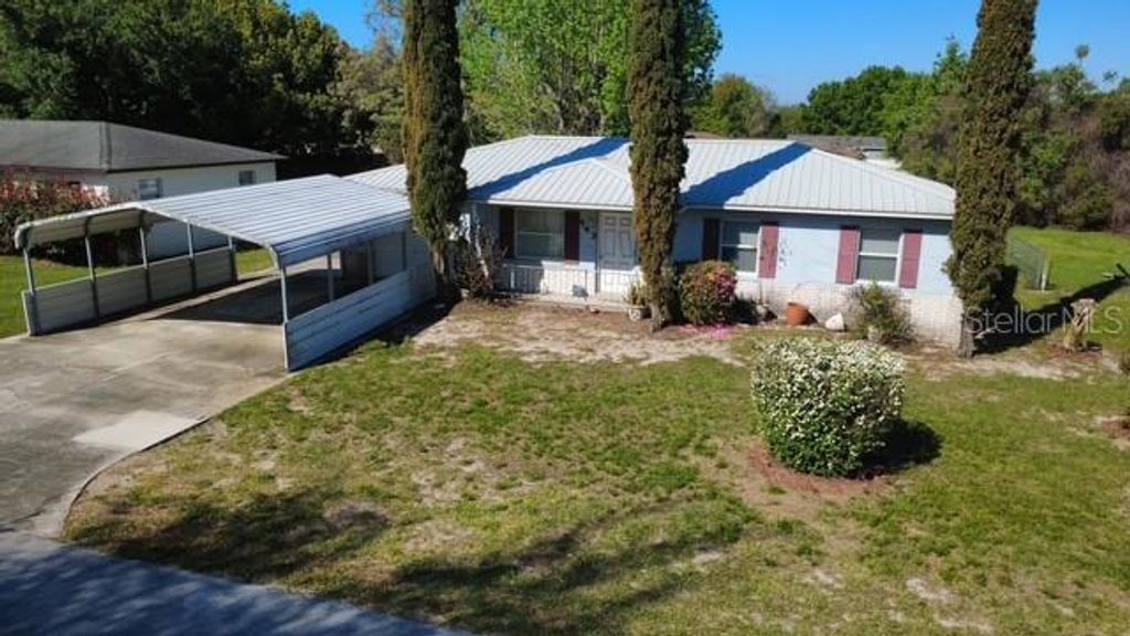 Photo of 443 Winners Circle, Lady Lake, FL 32159 (MLS # G5110036)