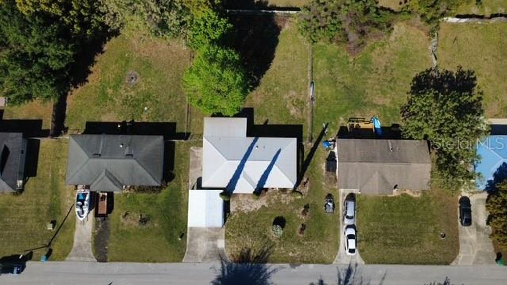 Photo of 443 Winners Circle, Lady Lake, FL 32159 (MLS # G5110036)