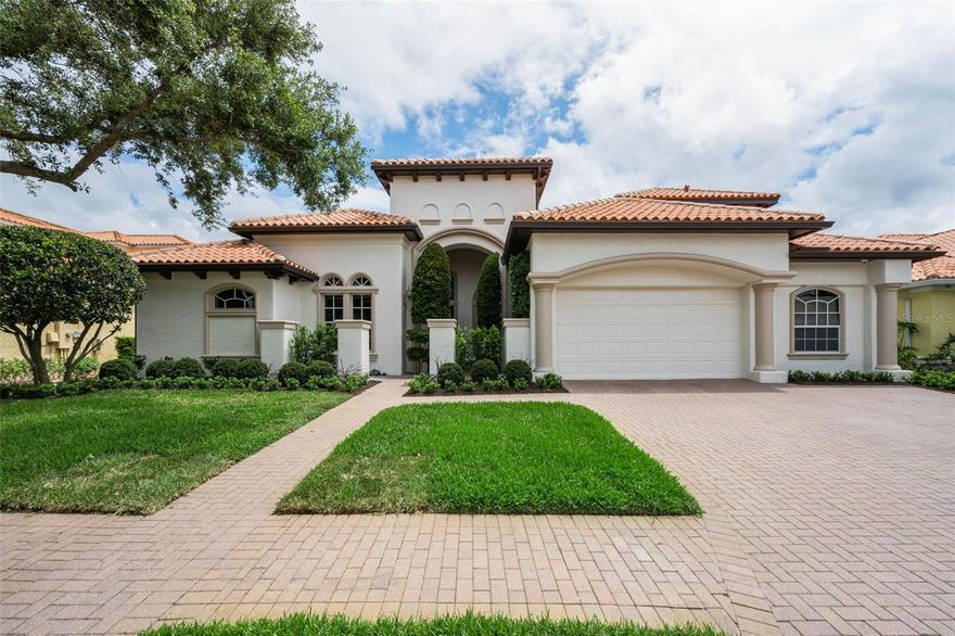 Experience refined luxury in this beautifully updated dream home, ideally situated in one of the most sought-after neighborhoods within The Champions’ Club. This exceptional former model residence offers an impressive blend of elegance and functionality, featuring five bedrooms—including two primary suites—four and a half bathrooms, a dedicated office, and an oversized garage.
A newly landscaped entrance creates a welcoming sense of privacy and curb appeal from the moment you arrive. Inside, tall custom front doors open to a light-filled, open-concept layout where expansive windows seamlessly connect the indoors to the lush outdoor setting.
The thoughtfully designed floor plan provides both comfort and versatility. One wing of the home is dedicated to the office and a luxurious primary suite, while the opposite wing includes two bedrooms connected by a full bath, plus an additional bedroom with its own hall bath. The main primary suite is a true retreat, complete with a custom-designed walk-in closet, dual vanities, a spa-style jetted tub, and a separate walk-in shower.
At the heart of the home, the gourmet kitchen showcases a striking white quartz countertops and new solid wood cabinetry, a spacious pantry, and top-of-the-line appliances—perfect for both everyday living and entertaining.
Step outside to an expansive covered lanai designed for effortless indoor-outdoor living. The self-cleaning saltwater pool and spa offer a resort-like experience with minimal maintenance. Two distinct outdoor seating areas enhance the space, including one with a built-in fireplace, alongside a fully equipped outdoor kitchen—ideal for hosting gatherings year-round.
Upstairs, a private and generously sized bedroom suite features a walk-in closet and full bath, making it perfect for guests or multigenerational living.
Located within the prestigious and welcoming Champions’ Club community, residents enjoy convenient access to exceptional amenities. The clubhouse—just a short bike ride away—offers a fitness center, gathering and game rooms, a spacious veranda overlooking Fox Hollow Golf Course, and a private pool with an outdoor kitchen. This gated community is also just minutes from the vibrant Trinity area and top-rated schools.
This home offers the perfect balance of luxury, comfort, and community—an exceptional place to live, work, and play.