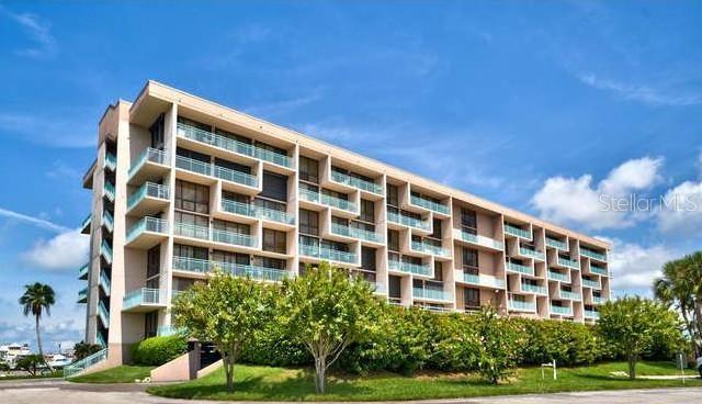 Escape to a captivating symphony of nature’s wonders in this stunning 1 bedroom, 2-bath Key Capri condominium. This, beautifully furnished unit is being sold with all the furnishings, giving you immediate ownership of luxury. The buildings of Key Capri have been fully remodeled, and the renovations are paid for. New tiled lobbies, new carpeted hallways, the entire interior of the building freshly painted, ready for its new residents. This idyllic sanctuary offers breathtaking sunset and views over the waters of Boca Ciega Bay from your private balcony. Stepping inside, you are greeted with an immaculate interior where elegance and charm blend effortlessly. The open concept 915 sq. ft of living space boasts a sleek, modern, and spacious design that will please the most particular buyers. Floor-to-ceiling windows provide open, bright, light-filled rooms. The master bedroom has a Murphy bed, giving the condo versatility of space. The updated kitchen has newer appliances: Refrigerator, Stove, dishwasher, Microwave. and Washer & Dryer. Mechanical upgrades include A/C and hot water tank also replaced recently. Designed for ease and comfort, this home provides single-level living and a true “lock-the-door and walkaway” lifestyle. The residence includes a deeded parking place in the garage and an additional storage unit for all your beach gear. Outside, a world of recreation awaits. This gated, residential community has world class amenities, including covered Kayak storage and a kayak launching dock. Take a refreshing dip in the 60,000 geothermal swimming pool heated in the winter and cooled in the summer or try the hot tub. Fishermen are in paradise with quick access to the Gulf of Mexico through Johns Pass Bridge. The cost of a boat slip is $4.60 of length of your boat. Free electric and water at each slip. Or wander up to the the Tiki hut and talk with neighbors. Also, for your pleasure are the following; tennis court pickle ball, shuffleboard, baroque, fishing pier, social room for private parties, library, exercise rooms and sauna. Walk to the beach a short walk from the condo. Bike around the Isle of Capri. Dreams do come true at Key Capri Condominiums.