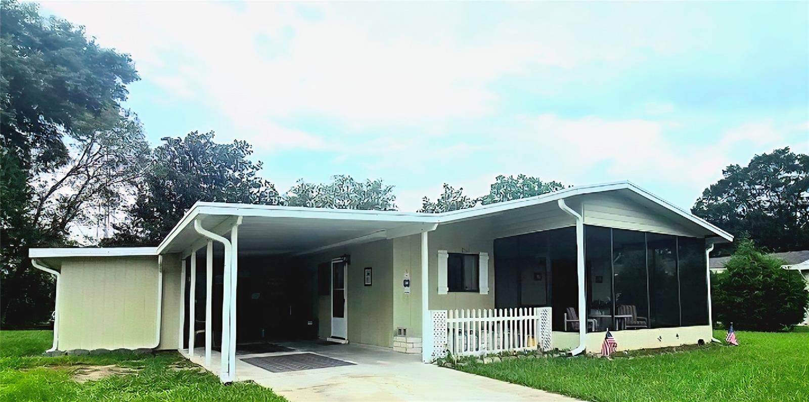 Furnished! MUST SEE. New roof in 2018, a new water heater in 2016, and updated plumbing and electrical systems. The HVAC system has been updated 2024, ensuring year-round comfort. Deed restricted w/monthly maintenance $147. This fee includes access to the pools and recreational facilities, basic cable TV, and weekly trash collection. 2 bedroom, 2 bath single-family home is situated in a vibrant 55+ community, offering comfort, convenience, and style. Step inside to discover a meticulously maintained interior boasting laminate tile vinyl flooring throughout, creating a seamless flow from room to room. The sunlit screened lanai provides the perfect spot to unwind with a morning cup of coffee or relax with a good book, offering tranquil views of the surrounding greenery. The heart of the home features a remodeled kitchen adorned with new tile flooring, abundant cabinetry, and sleek appliances, making meal preparation a breeze, the home has been repiped for added peace of mind. Additional highlights include a separate workshop and ample storage space, perfect for hobbyists or outdoor enthusiasts. The carport provides shelter for your vehicles, while the landscaped yard offers privacy and serenity. This home has been meticulously maintained, with recent upgrades. Conveniently located less than 10 miles from the World Equestrian Center, this property offers easy access to abundant shopping, recreational facilities, and community amenities. With two pools, two clubhouses, and plenty of opportunities for leisure and entertainment, this is truly a place to call home. Don't miss out on the opportunity to make this beautiful home yours. Schedule your showing today and experience the best of Florida living!