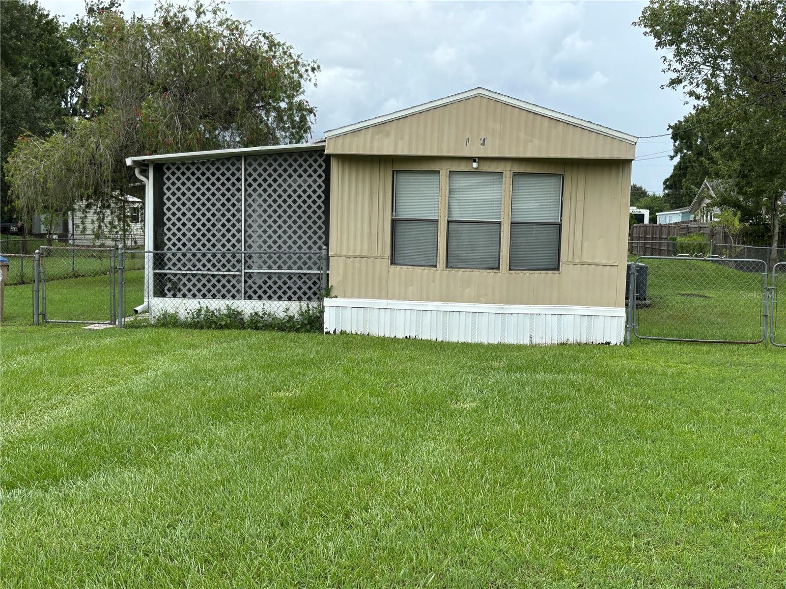 More Pictures Coming Shortly. Looking for a place that gives you freedom, not just square footage? This two-bedroom, two-bath home in Kissimmee brings comfort and simplicity together in just the right way. Tucked into a quiet spot with over 7,400 square feet of land, you’ll love having room to breathe inside and out. The open layout makes daily life easy, with central air to keep things cool and all the essentials included, from a full-size washer and dryer to a kitchen ready for any recipe. Whether you’re settling in or just starting, this space is move-in ready, featuring low-maintenance elements such as vinyl flooring and concrete accents. Ready to walk through it yourself? Let’s set up a time to see it.