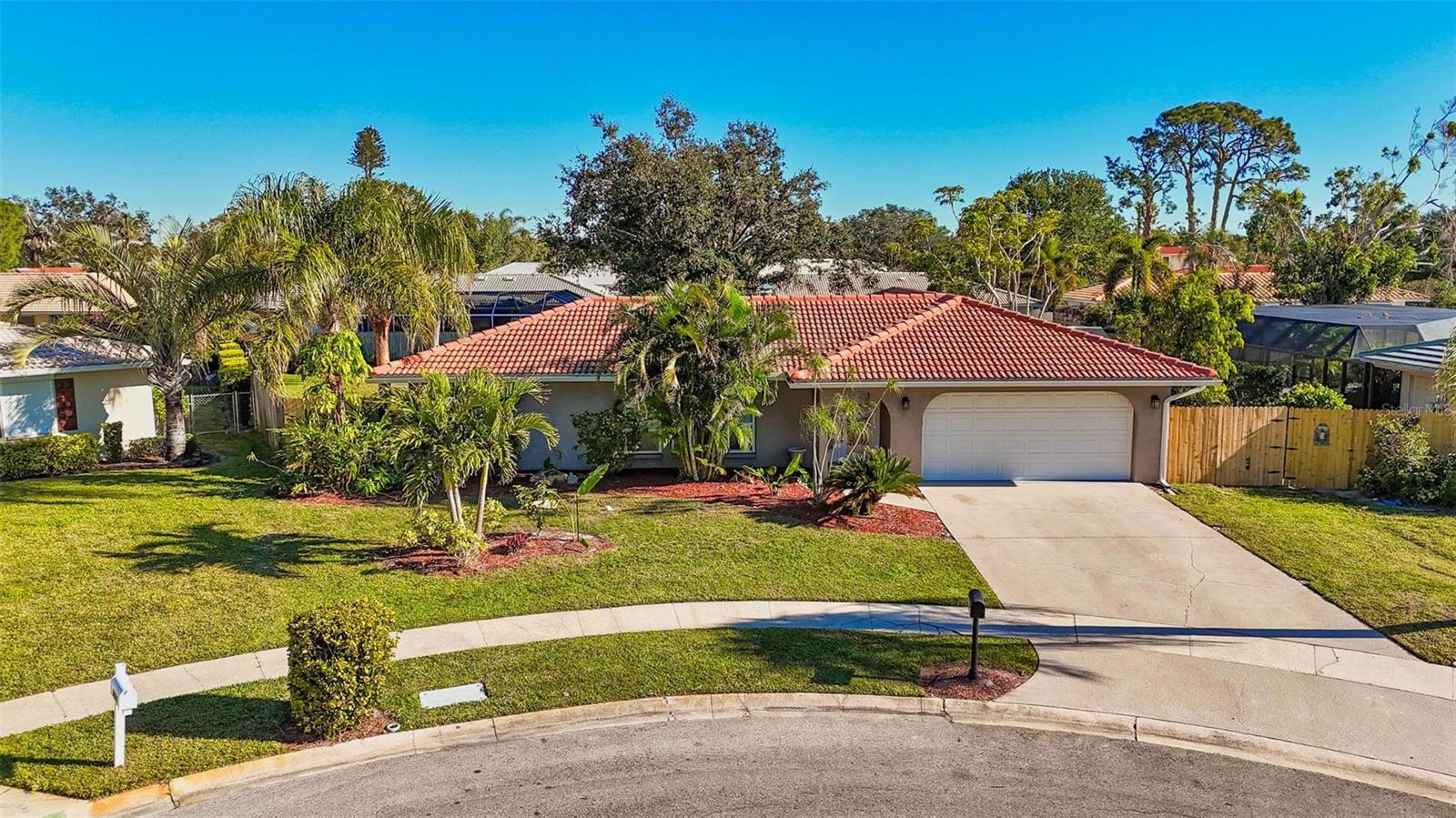 WOW!!! A MUST-SEE home-gem! IT HAS IT ALL: Over 2,100 S.Q. Ft., 4-bed 2 full bath home renovated inside and out, sits on a large pie-shaped lot located on a quiet Cul-de-Sac, has a huge tranquility-filled landscaped backyard with heated in-ground pool, fruit-trees garden and plenty of space to entertain, has a new irrigation system throughout the lot - nothing to do or fix - just enjoy! This impeccably and thoughtfully maintained home just happens to be in the desirable Gulf Gate Estates, surrounded by homes just as gorgeous, it is only 3 min to the restaurants & shopping and 10min to the great Siesta Beach!!! This home's kitchen is large and accommodating for entertaining, having granite counters and stainless-steel appliances. Interior also has a wood-burning fireplace, whole house water filter system, crown molding, tile flooring, jetted tub, ceiling fans and an oversized laundry room... just to name a few. The tile roof is only 10 years old with a warranty, the A/C and the rest of the systems are all regularly serviced. Freshly painted entire interior and professionally landscaped lot. Spotless, inside and out! HURRY BEFORE IT IS SNAPPED BY SOMEONE ELSE!!!