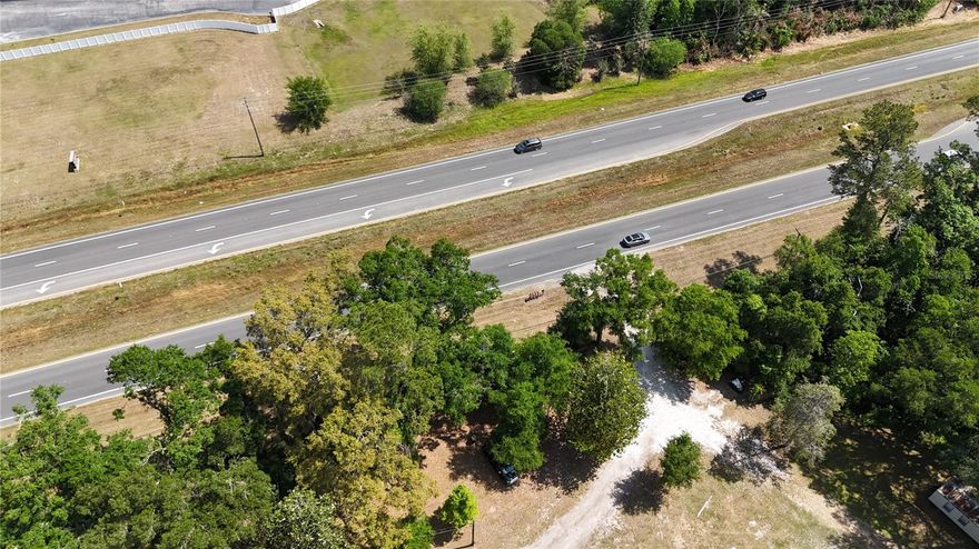This 16.81-acre property offers a prime opportunity for mixed-use development, boasting approximately 700 feet of frontage along Highway 441 near the entrance to Turkey Creek, a well-established residential community with over 1,100 single-family and multi-family homes. The site features split zoning, providing flexibility for a wide range of uses. The front 8.5 acres are zoned Community Commercial (CC), allowing for high-demand uses such as gas stations, auto services, large-scale retail, hotels, medical and dental clinics, veterinary offices, pharmacies, and convenience stores. The rear 8.31 acres are zoned Agricultural (A) with a future land use designation of Residential Moderate Density, making it well-suited for residential development. Located in a high-visibility, rapidly growing corridor, this property is ideal for a thoughtfully planned mixed-use project that meets both commercial and residential demand. In the interim, benefit from steady income generated by five occupied rental units on the property, which include two mobile homes, one single-family residence, and one duplex.