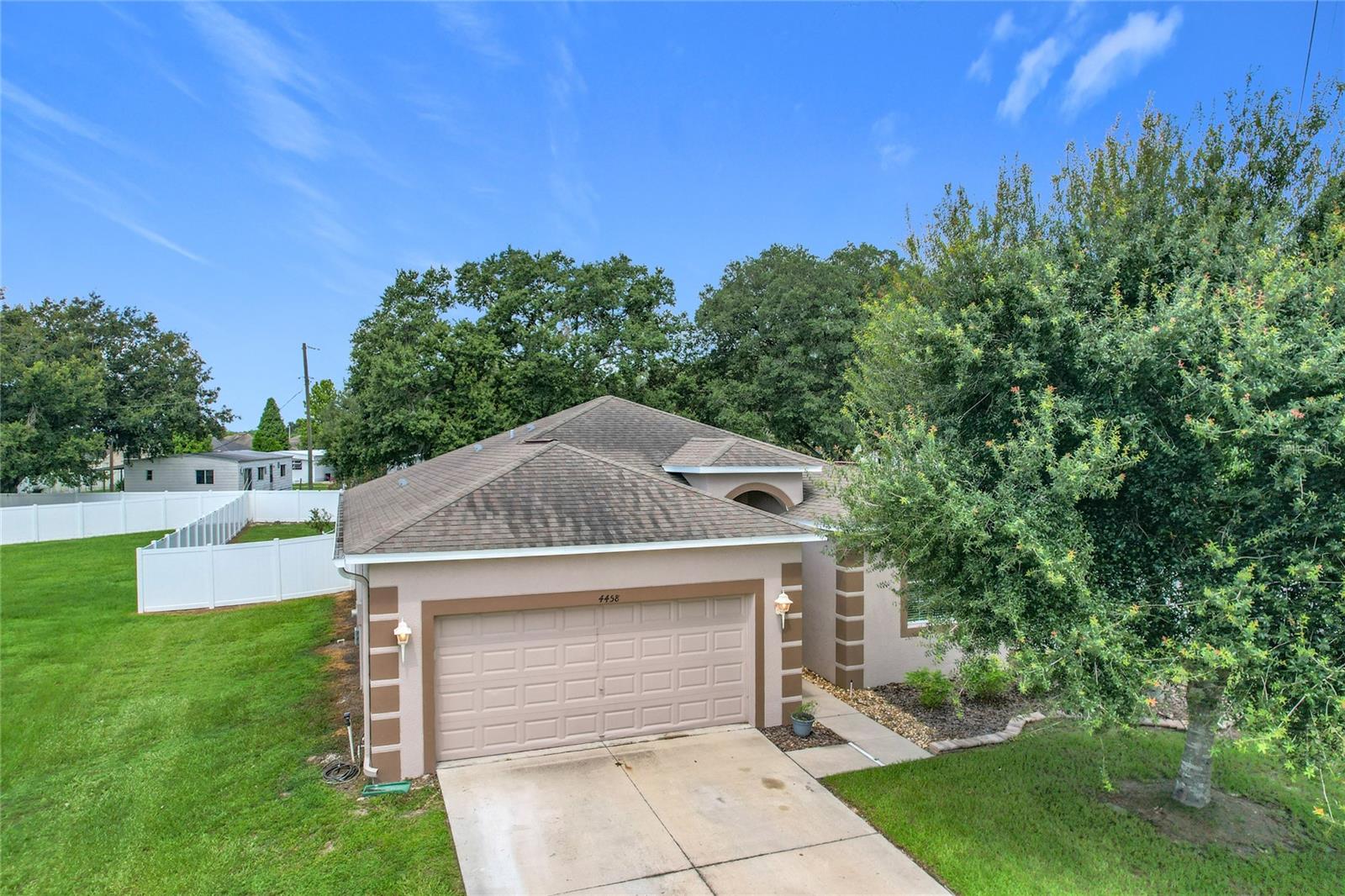 This beautifully renovated 3 bedroom 2 bath home offers a split floor plan and sits on on oversized lot. The updated kitchen offers quartz countertops, marble backsplash, soft close cabinets, newer appliances and a custom built island. A stylish touch/tap faucet adds both convenience and elegance. The open concept floor plan is perfect for entertaining. The home features ceramic tile floors designed to look like wood. The primary suite is like your own personal spa. It features two closets and an updated vanity. You will fall in love with the luxurious walk in shower with dual shower heads, two benches and built in Bluetooth speaker. The AC and duct work are new. The home is surge protected, all breakers have been replaced with safety breakers. There is a covered patio that overlooks a large privacy fenced backyard. This community has sidewalks and a community pool.