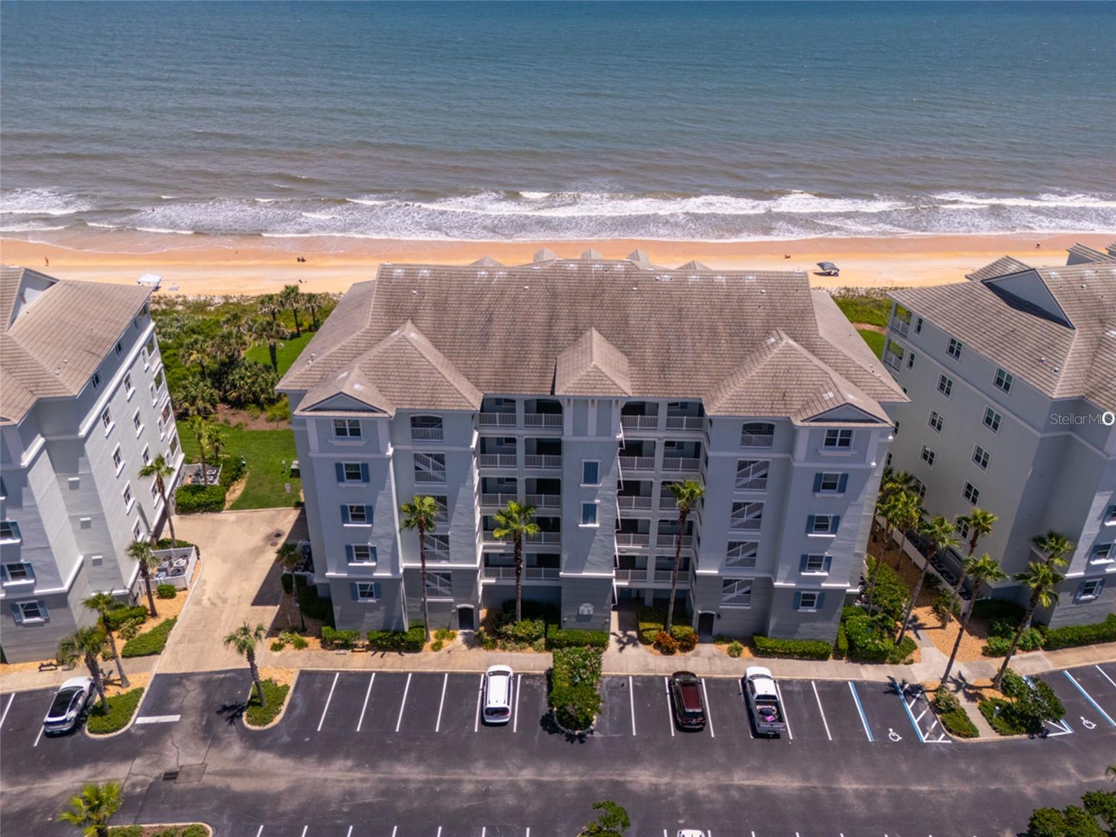 Wake up to breathtaking direct ocean and beach views from this third-floor, 3-bedroom, 2-bath condominium in the highly sought-after Cinnamon Beach community. Enjoy spectacular eastern sunrises and cool sea breezes while overlooking the cinnamon-colored sands and rolling Atlantic waves. This desirable floor plan is the only one in Cinnamon Beach featuring balcony access from both the main living area and the master suite, thanks to a private sliding glass door from the bedroom. The tiled balcony is the perfect spot to watch dolphins, and North Atlantic right whales migrate offshore between November and April. Inside, the home has been freshly painted and features new carpet and all-new high-end appliances, including refrigerator, stove, microwave, dishwasher, washer, and dryer, plus a new water heater. The remodeled kitchen shines with new cabinets and granite countertops, while both bathrooms have been upgraded with new cabinets and countertops. Designer furnishings from Crate & Barrel and Pottery Barn are included, making this home move-in ready. This condo has not been rented, has been privately owned and meticulously maintained, and includes a private storage locker in the garage.
Community highlights include two resort-style pools, a game room, fitness center, seasonal restaurant/café, and a convenient beach walkover just steps away. Short-term rentals are permitted, offering exceptional investment potential.