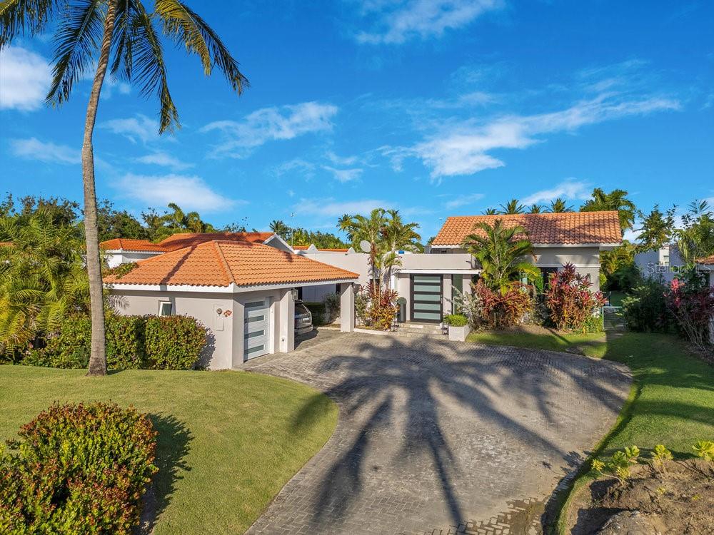 Here’s your chance to own the best-priced home in Dorado Beach East—the crown jewel of Dorado Beach. This isn’t just a home; it’s an entry into one of the world’s most exclusive lifestyles, set within the lush, tropical paradise of Puerto Rico’s most prestigious community.
Step inside and be captivated. Recently renovated with a designer kitchen and luxury finishes throughout. The spacious layout flows effortlessly, maximizing natural light and creating an inviting ambiance perfect for both relaxed living and high-end entertaining.
The outdoor experience is second to none. Your own resort-style pool awaits, surrounded by mature landscaping for ultimate privacy. Whether it’s a sun-soaked afternoon with family or an evening of poolside entertaining, this backyard oasis sets the stage for unforgettable moments.
And let’s talk about lifestyle. Living in Dorado Beach East means exclusive access to the world-class amenities of Dorado Beach, a Ritz-Carlton Reserve—from championship golf courses designed by Robert Trent Jones Jr. to five-star dining experiences, the iconic Encanto Beach Club, and the renowned Spa Botánico. It’s not just a home; it’s a resort-style living experience like no other.
This is a rare opportunity to own a move-in-ready designer home in one of the most sought-after communities on the planet, at an unmatched value. Don’t miss it.