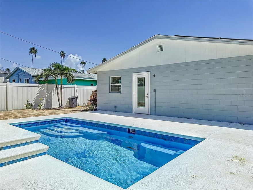 One or more photo(s) has been virtually staged. Welcome to this beautifully renovated home located in the desirable Shore Acres neighborhood of St. Petersburg. This spacious residence offers modern finishes, comfort, and the perfect Florida lifestyle.

The interior features tile flooring throughout all living areas, creating a clean and cohesive look. The updated kitchen showcases quartz countertops, stainless steel appliances, and a sleek custom tiled backsplash, perfect for both everyday living and entertaining. The master suite includes a large walk-in closet and a beautifully designed bathroom with a custom tile shower. Truly special fixtures and finishes can be found throughout the home, with no detail overlooked.

Enjoy the inviting screened front porch and a huge backyard complete with a private pool, ideal for relaxing or entertaining year-round. The home also includes a garage for added convenience.

Located just minutes from Downtown St. Petersburg, the Pier, waterfront parks, restaurants, and shopping, this property offers both tranquility and accessibility in one of the city’s most sought-after neighborhoods.