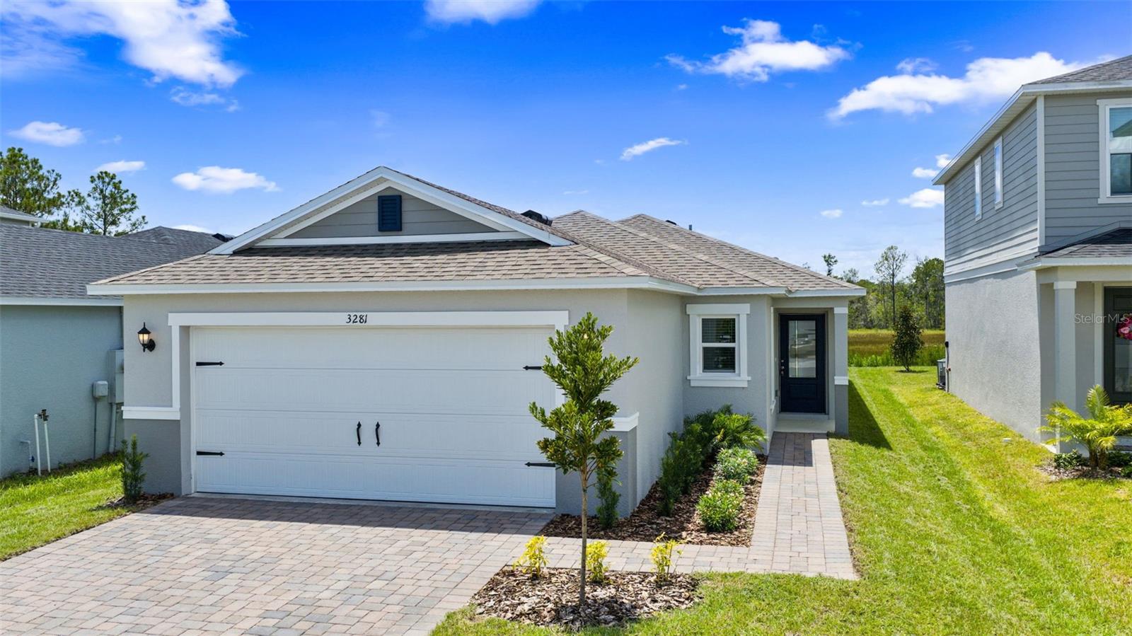 Experience modern comfort and style in this beautifully designed single-story home. Featuring an open-concept layout with soaring volume ceilings and sleek tile flooring throughout the main living areas, this home is both elegant and functional. The spacious kitchen is equipped with granite countertops, 36” upper cabinets, a central island, chrome faucet, and a full suite of stainless steel appliances—perfect for everyday living and entertaining.
The private primary suite offers plush carpeting, a generous walk-in closet, and an en-suite bath with a dual-sink vanity, walk-in shower with tile surround, and ample linen storage. Additional highlights include a dedicated laundry room with garage access and a covered back patio ideal for relaxing or hosting guests.
Enjoy scenic views and access to a newly built community clubhouse and sparkling pool. Don’t miss the opportunity to be the first to live in this stunning home! This home is unfurnished and move-in ready!