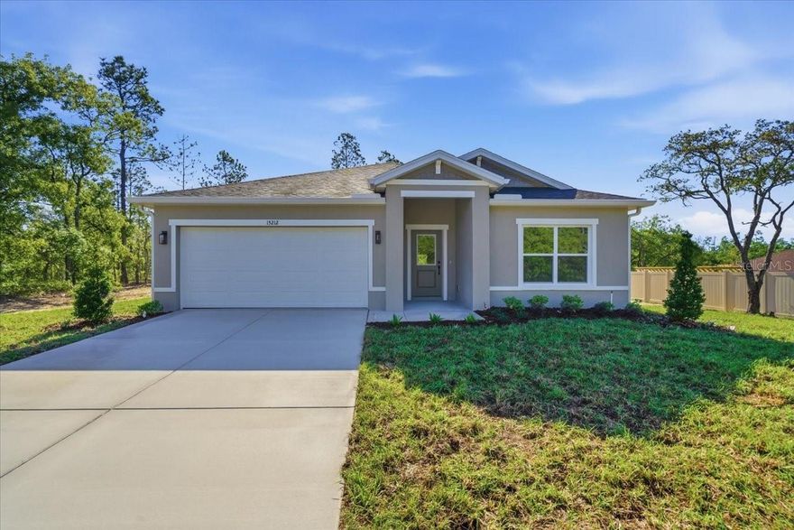Welcome to this beautiful NEW CONSTRUCTION, MOVE-IN-READY, 4-bedroom, 2-bathroom home offering 1,871 sq ft of thoughtfully designed living space, perfectly situated on a spacious ½-acre lot in the highly desirable Royal Highlands community of Weeki Wachee. This single-level residence features an open-concept floor plan ideal for both everyday living and entertaining.
Luxury plank flooring flows throughout the home, complemented by tiled floors in the bathrooms and granite countertops in the kitchen & both bathrooms.
Have peace of mind with a completed 3rd party pre-inspection, backed by a 2-10 home warranty included. The front and rear landscaping features a full irrigation system.
With its combination of space, upgrades, and location, this move-in-ready home offers the perfect balance of comfort & value in a growing area. Don’t miss the opportunity to own a slice of Florida living!