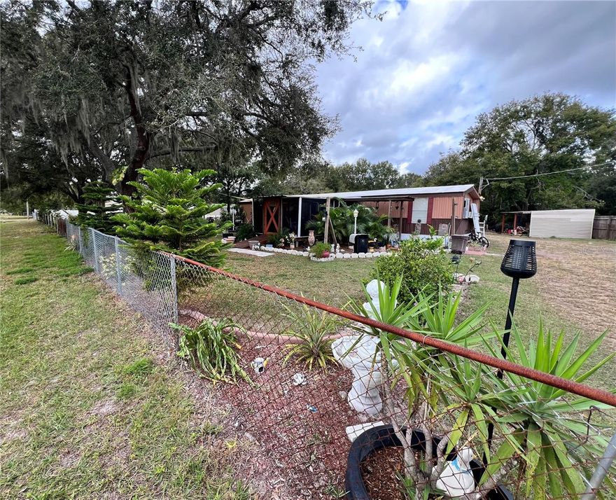 DO NOT MISS THIS OPPORTUNITY TO OWN 1.4 HIGH AND DRY ACRES WITH THE FREEDOM OF NO HOA!!! This 2 bedroom, 2 bathroom home is surrounded by beauty! The house sits close to the front of the property allowing for the majority of your 1.4 acres to be open to ENDLESS POSSIBILITIES!!! LIKE ~ Build your new custom home! Build your dream monster garage! Plant a massive garden. Raise all your animals. Park ALL YOUR TOYS... The middle of the property is already fenced and gated perfectly for keeping animals separate and safe OR giving additional families members their own space and place to live! Enjoy the serenity of country life feeling while living close to EVERYTHING convenient for life...