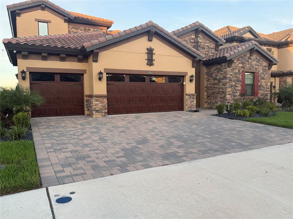 Photo of 10958 Rustic Timber Loop, San Antonio, FL 33576 (MLS # TB8432309)