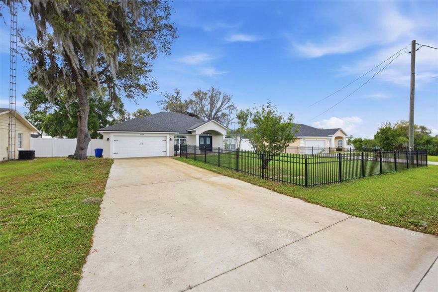(Brand new roof and new well pump!!!) - NO HOA-
Where comfort, privacy, and modern upgrades come together in a truly move-in-ready home.
This beautifully renovated 4-bedroom, 2-bath residence has never been lived in since its transformation, offering a fresh, like-new experience from the moment you step inside. The heart of the home features stunning new Quartz countertops, perfectly complementing the updated finishes and inviting layout designed for both everyday living and entertaining.
Enjoy peaceful mornings and relaxing evenings with picturesque views of Smith Lake, right from your own property. The spacious backyard is fully enclosed with a privacy fence, creating a perfect retreat for gatherings, pets, or simply unwinding. Out front, a charming iron-fenced area adds curb appeal and a touch of elegance.
Inside, the home continues to impress with a luxurious soaking tub in the primary bath, generous bedroom space, and a 2-car garage for convenience. Step outside to a large back porch sitting area—ideal for enjoying Florida’s beautiful weather year-round. Mature fruit trees add both beauty and function to the landscape.
Located in a highly desirable neighborhood, this home offers the perfect blend of tranquility and accessibility. If you're looking for a turnkey property with modern upgrades, scenic views, and plenty of outdoor space, this one checks every box.