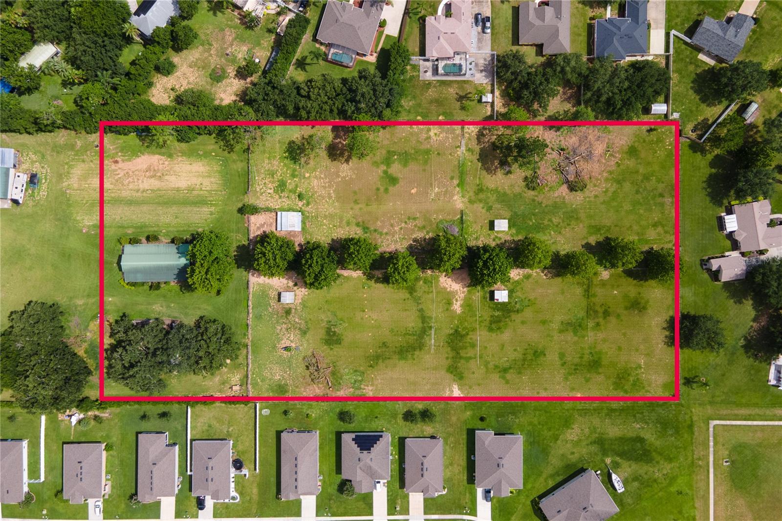 ESCAPE TO THE COUNTRY — WHILE STAYING CLOSE TO IT ALL! Discover this lush, 5-ACRE slice of Florida HIGH LAND PASTURE—mostly fenced and semi-improved with an 8 STALL, CENTER-AISLE HORSE BARN, chicken coop, and misc. animal shelters. It's a rare opportunity to enjoy a rural lifestyle in one of the LAST REMAINING pockets of COUNTRYSIDE, all within minutes of modern conveniences. Tucked away yet close to charming Mount Dora, Eustis, and even The Villages, this property offers BALANCE between SPACE and ACCESSIBILITY. Grocery stores, restaurants, and shopping are just a short drive away, and if you're commuting from Orlando, the scenic ride back home feels like a daily retreat. Whether you're dreaming of homesteading, GARDENING, keeping horses, SELF-SUSTAINING, or just spreading out and enjoying nature, this land is ready for your vision. The barn, existing structures—and yes, even the chickens—can stay! The buyer will need to install a well and septic, but the groundwork for your rural dream is already in place. Come create your own peaceful haven. Call today for your appointment to realize your vision.