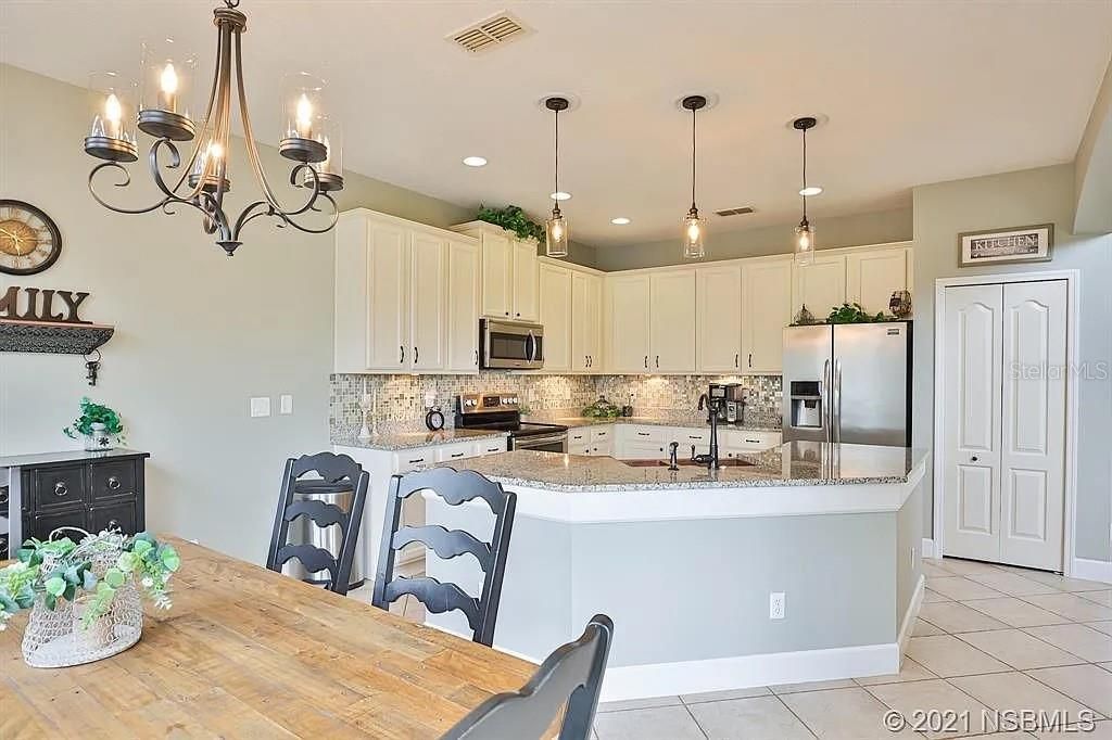 Photo of 453 Venetian Villa Drive, New Smyrna Beach, FL 32168 (MLS # TB8412233)