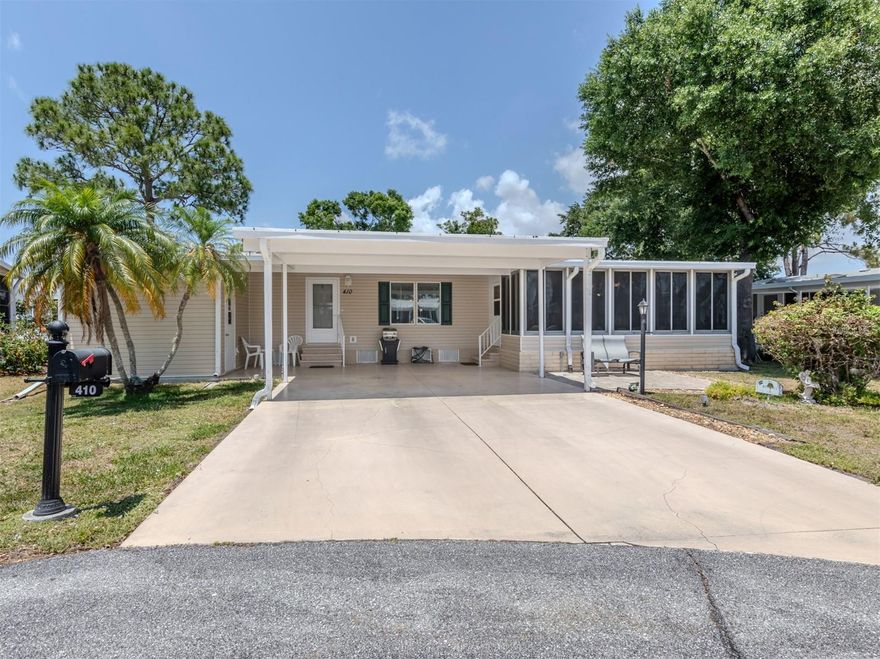 Welcome to your dream retreat in the heart of The Village at Riverwalk, North Port, Florida. Nestled on a serene cul-de-sac, this meticulously maintained 3-bedroom, 2-bath Palm Harbor manufactured home offers 1512 square feet of turnkey furnished bliss. Its unique sideways positioning enhances curb appeal, complemented by a spacious double carport and a generously sized Florida room with acrylic windows, ensuring year-round comfort and enjoyment. 
Step inside to discover a chef's delight in the large cook's kitchen, boasting ample cupboard and counter space along with a convenient pantry. Vaulted ceilings amplify the open and airy ambiance, while laminate flooring throughout the living and bedroom areas adds a touch of elegance. The guest rooms feature walk-in closets for added convenience, while the master bath showcases a luxurious walk-in linen closet, an extra-long vanity, and a stunning tile walk-in shower. Beyond the comforts of home, residents of Riverwalk relish in a wealth of amenities including a kayak launch for aquatic adventures, shaded walking trails amidst mature trees, and a vibrant community spirit that fosters endless opportunities for recreation and relaxation. Experience the epitome of Florida living in this inviting haven, where every detail has been thoughtfully curated for your utmost enjoyment.