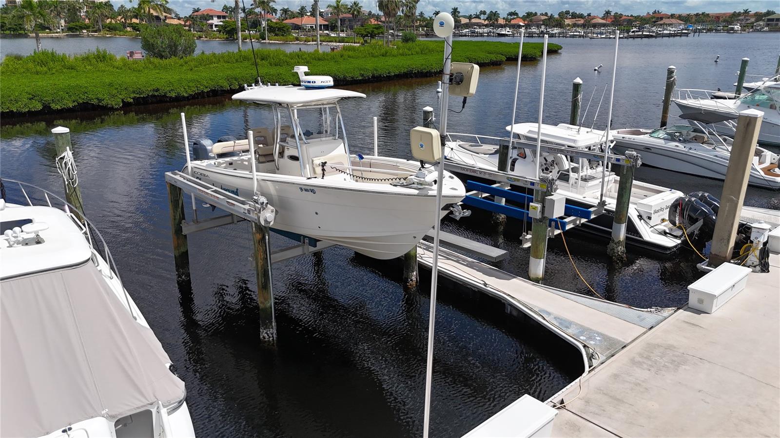 Own your piece of paradise with this premium deep-water boat slip at N-20 on North Dock with a 13,000lb lift at the highly coveted Riviera Dunes Marina. Located on Florida’s beautiful Gulf Coast, this protected marina is one of the safest harbors in the region with easy access to Tampa Bay, the Intracoastal Waterway, and the Gulf of America.
This floating dock slip measures 35' x 19.1', accommodates vessels up to 45 feet in length, offers 50 amp shore power, pump-out at each slip, and Wi-Fi. Owners enjoy full access to the marina's resort-style amenities, including gated parking, 2 floating heated pools, pet walking area, social docks with 3 grills, laundry facilities, private bathrooms and showers, and an on-site fuel dock.
With 24-hour gated security, Riviera Dunes offers luxury, safety, and convenience. Minutes from waterfront dining, downtown Bradenton, and Sarasota. The Dockside Restaurant is great place for food and drinks. Don't miss the Happy Hour Menu!
This is a rare opportunity to own in one of Florida’s top-rated marinas—perfect for seasonal boaters or as a rental investment! Purchased slips can also be rented and managed by the marina or owner. You do not need to own a home or condo to purchase a slip here at Riviera Dunes Marina.