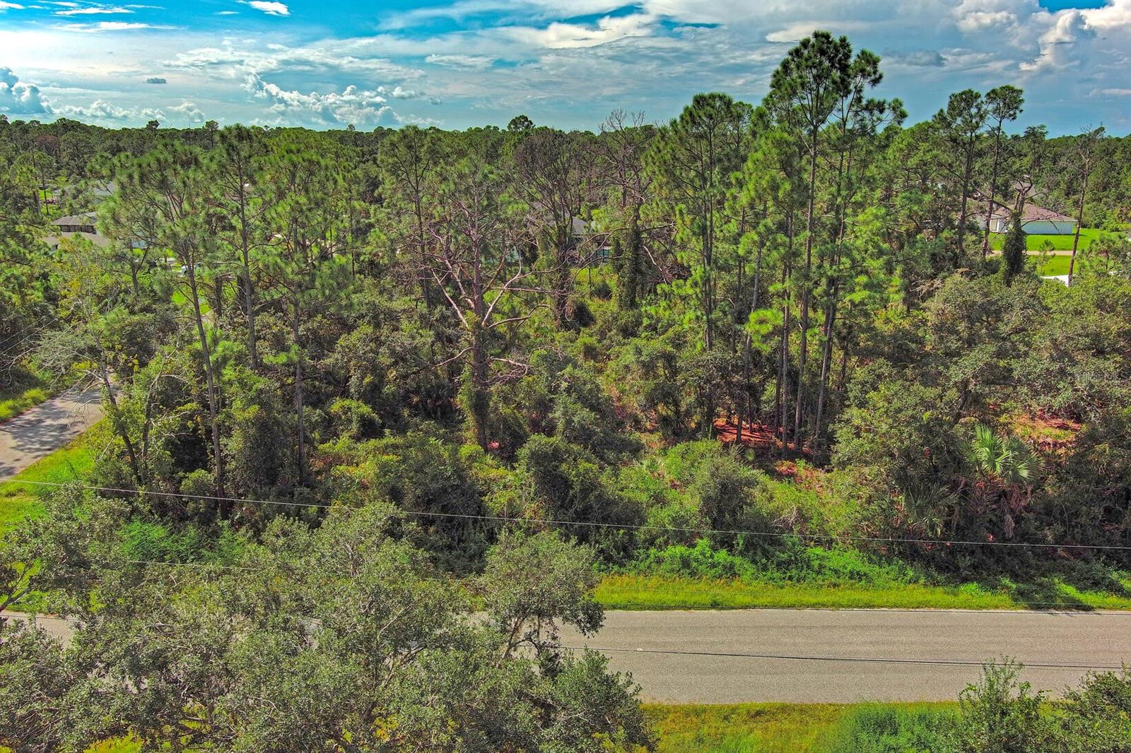 Exclusively listed by Sunland Real Estate: This centrally located 0.28-acre corner lot in North Port, Florida, is high and dry with no flood zone. Conveniently close to I-75 and major roads, it offers the perfect location for your next home. North Port, FL is a rapidly growing city known for its family-friendly atmosphere, proximity to Gulf Coast beaches, and easy access to both Sarasota and Fort Myers. The city also offers a variety of outdoor recreational activities, including hiking, golfing, and access to Warm Mineral Springs.