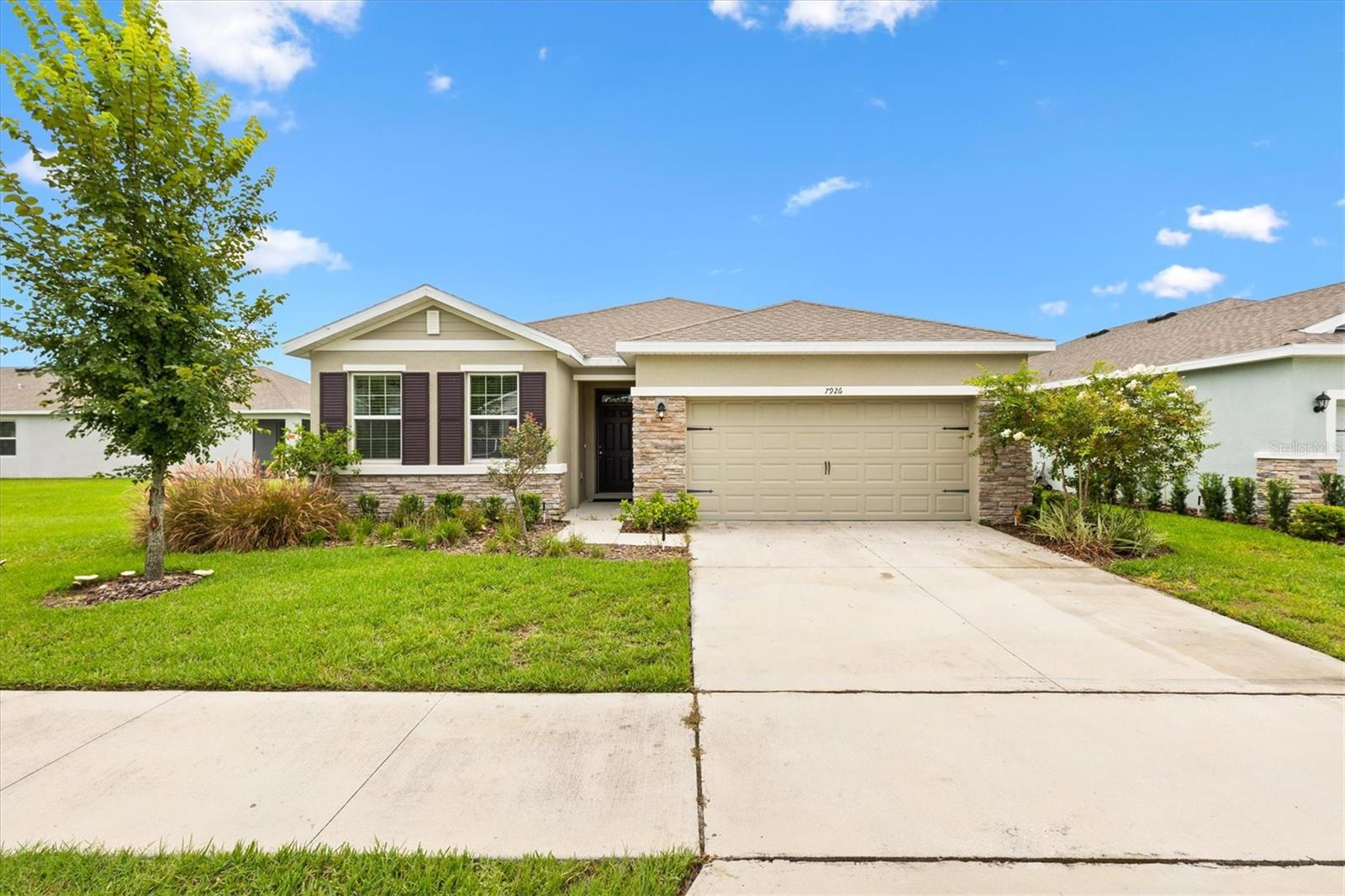 Welcome Home! This stunning 4BR/2BA residence in the desirable Beaumont community is truly move-in ready! Offering a perfect blend of comfort, convenience, and style, this home sits in a quiet neighborhood with incredible amenities—resort-style pool, cabana, state-of-the-art clubhouse, fitness center, pickleball and bocce courts, plus a scenic multi-modal trail. Best of all, lawn care, cable, internet, and exterior pest control are all included in the HOA—giving you more time to enjoy the lifestyle you deserve. Located in Wildwood, just minutes from The Villages, Target, Home Depot, schools, dining, and endless entertainment, everything you need is right at your fingertips. Inside, you’ll love the spacious 2,034 sq ft open floor plan, complete with an inside laundry room (washer & dryer included), a 2-car garage, and a peaceful screened lanai. The gourmet kitchen shines with shaker cabinetry, stainless steel appliances, granite countertops, and a large island overlooking the living and dining areas—perfect for gatherings. Thoughtful touches like recessed lighting throughout the home add extra warmth and style. The owner’s suite offers a true retreat with his/hers walk-in closet and spa-inspired bath featuring dual sinks, a walk-in tiled shower, and private lavatory. The three additional bedrooms all include walk-in closets, while the guest bath is conveniently located with a dual-purpose layout. Step outside to a backyard with ample green space and no neighbors on the left side, creating extra privacy. This home is packed with upgrades and lifestyle perks—don’t miss your chance to own it. Schedule your private tour today before it’s gone!