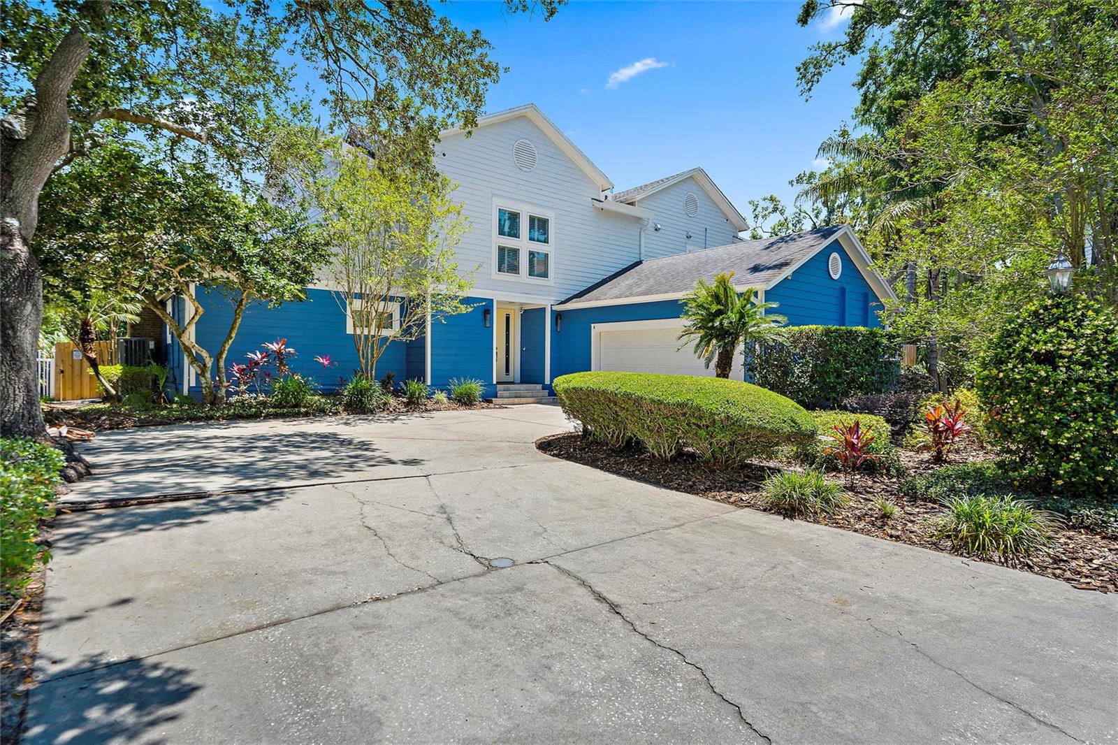 Under contract-accepting backup offers. Welcome to this rare double-lot oasis located in the most desirable school district of South Tampa (Mabry, Coleman, Plant). This 4 bedroom, 3.5 bath, 3,755 sq. ft. home has been completely renovated inside and out. Enjoy watching the kids play on this 0.46 acre lot while sitting poolside at the brand new pool/spa/pool deck, complete with an outdoor kitchen and living space. This home truly offers the space of luxury suburbia while being central to all of the benefits of South Tampa and Downtown. Let the stresses of life fade away as you pull onto this quiet cul-de-sac where you are greeted by a peaceful fountain surrounded by palm trees. The interior has been completely remodeled to create an open-floorplan kitchen/dining/living space that is ideal for families or entertaining guests. High-end appliances, ample counter space, and loads of solid-wood cabinet storage with pull-outs make this Nantucket styled kitchen a chef’s dream. Additional highlights such as the warming drawer, Kitchen-Aid mixer lift, and small appliance slide-out storage provide easy access while keeping a very clean look when not in use. Upgraded large windows and French doors access the expansive yard and provide lots of natural light throughout the first floor. The ground floor is completed by the half bath, large mudroom/laundry room, a two-story vaulted entryway and sitting room that will wow your guests, and finally the 2nd master which boasts a spacious designer bathroom with dual vanity and spa-like shower. A wood-burning fireplace, custom walk-in closet and French doors to the back yard complete this amazing guest bedroom vs downstairs master. Following the beautiful dark wood porcelain tile up the stairs takes you to a multipurpose loft with large storage closets and access to the additional rooms. Two nicely sized bedrooms with custom closets share the tastefully updated hall bathroom with shower/tub. Finally, the short hall opens into the massive redesigned owner’s suite. It boasts two large custom walk-in closets, a screened balcony to watch the kids at play, and a bathroom designed with comfort and functionality in mind. A second full-sized washer dryer are tucked into a closet in the larger walk-in, keeping laundry convenient. The owners spared no expense during the remodel, adding crown molding and custom wood-work throughout the home. All doors are solid core for privacy and noise dampening. Solar panels cut your power bill in about half and offer emergency power to outlets in the garage during power outages. The roomy two car garage has a built-in storage system and shelving that will convey. The outdoor remodel was just completed Fall of 2022 and included a new irrigation system, landscape lighting, large grass area big enough for playtime, and low maintenance landscaping to provide privacy along the new wooden fence while maximizing space to play. The highlight is certainly the large pool with sundeck, hot tub and covered area for entertaining and fully enjoying the Florida lifestyle. The pool is equipped with both heat pump and propane heaters for year round comfort. The entire area is caged in to keep things clean and bug free. A top-of-the-line complete outdoor kitchen with grill, side burner, refrigerator and prep sink will convey. Dual ceiling fans provide comfort and lighting while watching others in the pool or enjoying your favorite TV show or sporting event.