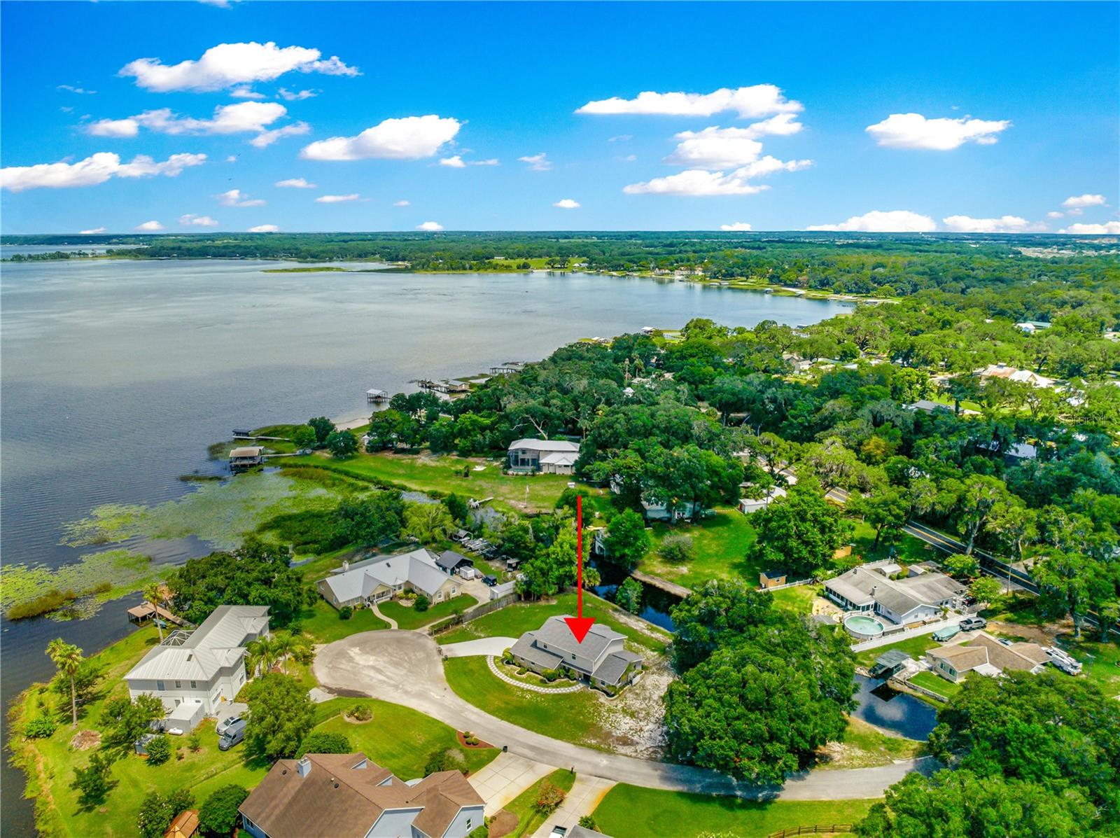 This beautifully renovated home sits on just over half an acre with canal access to Lake Weir—perfect for boating, relaxing, and enjoying the Florida lifestyle. It features a brand new roof (2023), new flooring throughout, two new A/C units, and water heater installed in 2024.
With over 2,500 sq ft of living space, this home offers 4 bedrooms and 3 full bathrooms. The open great room is ideal for entertaining, and the kitchen includes plenty of cabinets, Samsung appliances, and a stainless steel convection oven. A breakfast nook looks out to the backyard and canal.
The main floor also has a home office, a bonus room that can serve as a formal dining room or flex space, and a guest bedroom with an adjoining full bathroom—perfect for visitors or multi-generational living.
All bedrooms feature large walk-in closets, and the master suite offers a private bath with a whirlpool tub, double sinks, separate shower, and two spacious walk-in closets. Step out from the master onto your own private balcony, great for relaxing and enjoying the water view.
The 2.5-car garage provides extra space for storage or a workshop. Enjoy direct boat access to Lake Weir and cruise to Gator Joe’s or Eaton’s Beach for food and fun on the water.
Conveniently located near The Villages, hospitals, shopping, and restaurants, this move-in-ready home has everything you need.
Don’t wait—schedule your showing today!