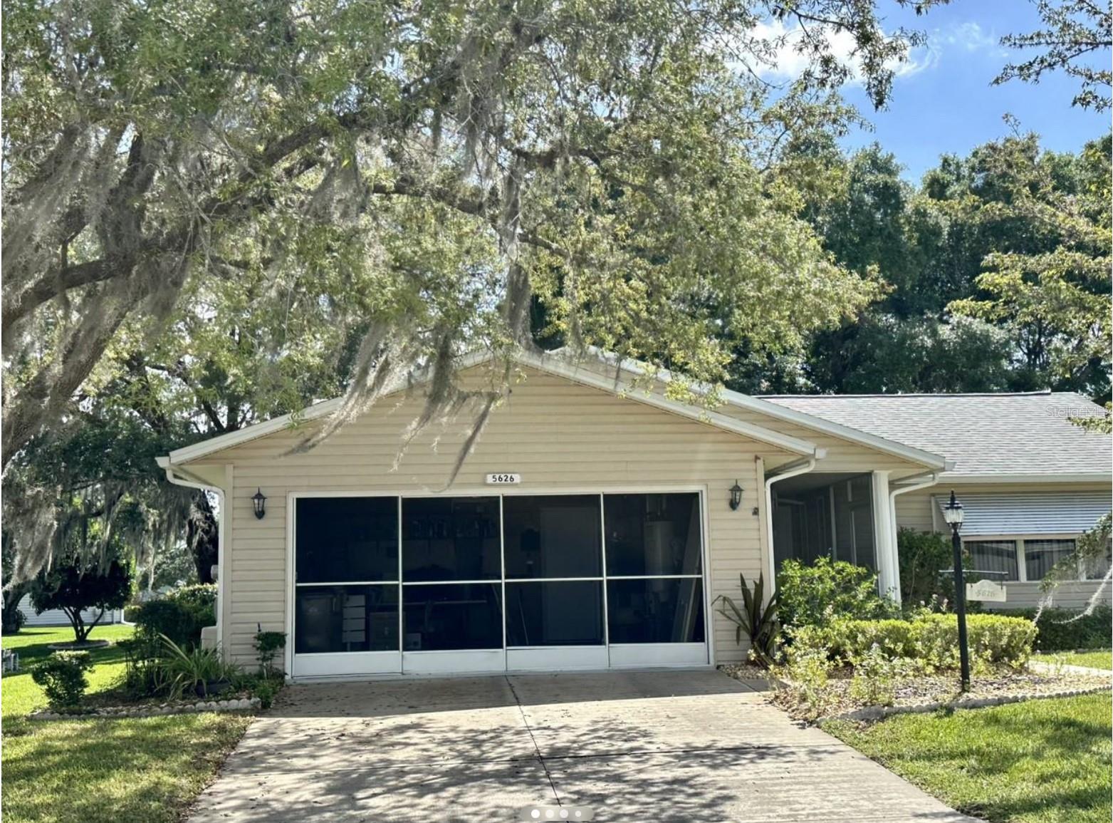 Discover the perfect home for active 55+ living at 5626 Austin St! This beautifully maintained residence features 2 bedrooms plus a versatile den, 2 full baths, and an inviting glass-enclosed lanai overlooking a private backyard ideal for relaxing or entertaining. Located in the highly desirable Highland Lakes gated community, residents enjoy outstanding amenities including indoor and outdoor pools, tennis, pickleball, bocce, shuffleboard, fishing, RV/boat storage, and a vibrant clubhouse with endless social activities, clubs, and events. The home offers an open-concept layout, updated fixtures, and a spacious 2-car garage, all just minutes from shopping, dining, medical facilities, and The Villages. Start living the lifestyle you deserve—schedule your showing today!