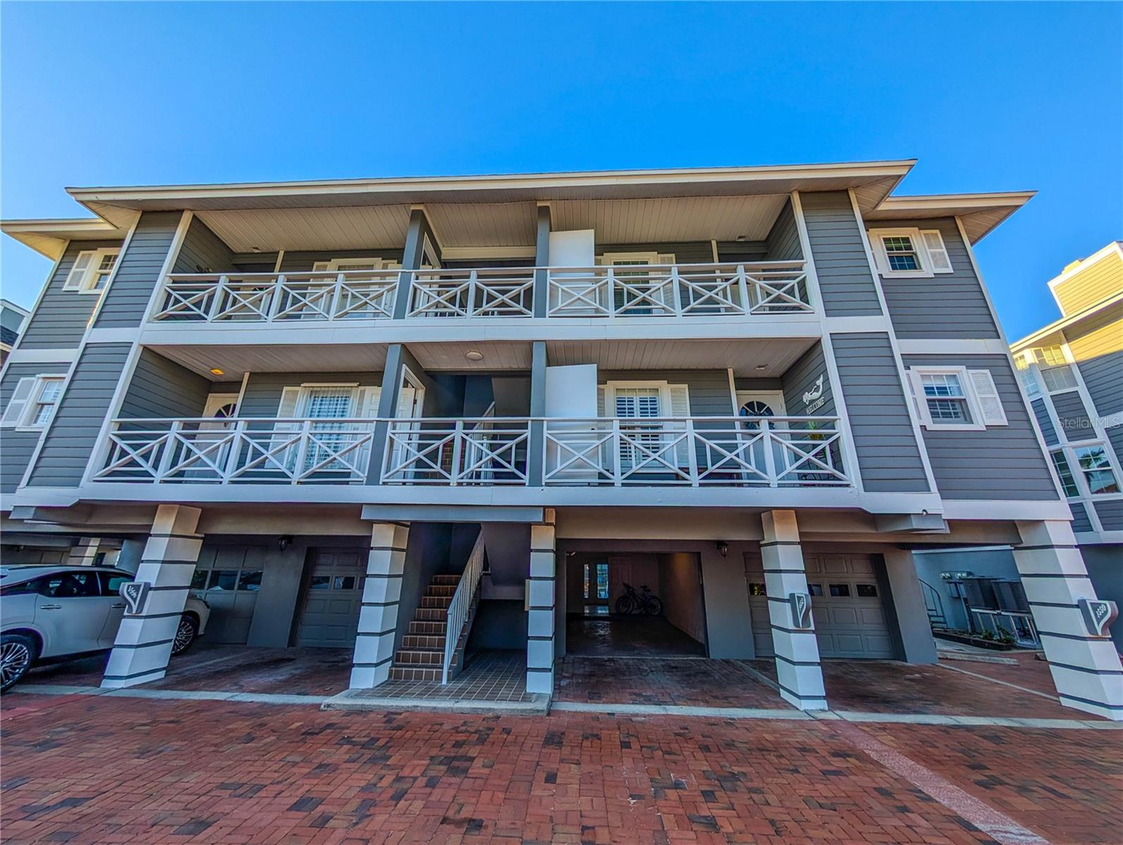 The Boatyard is a New England styled gated community of twenty one units located on the Intracoastal Waterway just across the south bridge from Siesta Key and its number one rated beach. Nearby are numerous opportunities for the shopping, dining, sports, and cultural activies that Sarasota is famous for. This furnished two bedroom, two bath unit features water views from most rooms, a bright open concept living/dining room with a tray ceiling and wood burning fireplace, an enclosed balcony overlooking a canal, updated kitchen and bathrooms, an oversized one car garage, and a ground level bonus room off the canal. In addition, the community amenities include a sundeck on the intracoastal waterway, a boardwalk along the canal, and a heated swimming pool. This is the Florida lifestyle you've been looking for.