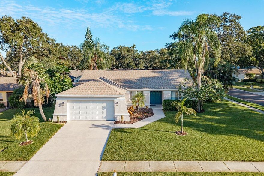 This beautifully updated home is move-in ready and full of recent upgrades that make it truly stand out. From the moment you arrive, you’ll notice the fresh landscaping and new sod that are maintained by a full irrigation system with its own well, all installed in 2024. A double-door entry opens into the bright and airy main living area, where vaulted ceilings and an open layout create a warm, welcoming atmosphere. From the front door, your eye is drawn straight through to the lanai and sparkling pool.


The modern kitchen was fully renovated in 2024 and includes a tray ceiling, recessed lighting, white shaker cabinets, granite countertops, and stainless steel appliances. A pass-through window offers optional bar seating and connects the kitchen to the living area, while a separate dining space makes entertaining easy. Multiple sliding glass doors open to the lanai and pool, filling the home with natural light and blending indoor and outdoor living.

The large and spacious primary suite features vaulted ceilings, a ceiling fan for added comfort, and an en suite bathroom with a dual-sink vanity, granite countertops, a walk-in shower, and a separate toilet room. The two guest bedrooms are equally inviting with laminate flooring, ceiling fans, and built-in closets, while the guest bathroom offers a tub and shower combination with fresh upgrades. An interior laundry room with built-in cabinets adds convenience and extra storage.

Step outside to your own backyard oasis. The lanai includes a generous covered area, perfect for relaxing in the shade, and overlooks the screen-enclosed sports pool that is shallow on both ends and deeper in the middle, ideal for both play and exercise. The entire pool area has been refreshed in 2024 with an updated enclosure and new screens, and a new pool pump. Beyond the pool, the fenced backyard offers fresh sod, a handy storage shed, and plenty of room to enjoy.

Additional updates completed in 2024 include new interior and exterior paint, new fans and light fixtures, all plugs, switches, and faceplates, updated faucets and vanities, a hurricane-grade garage door with opener, new garage side door, and a new hot water tank installed.
With its long list of thoughtful upgrades, spacious layout, and perfect indoor-outdoor flow, this home is ready for its next chapter. Schedule your private showing today!