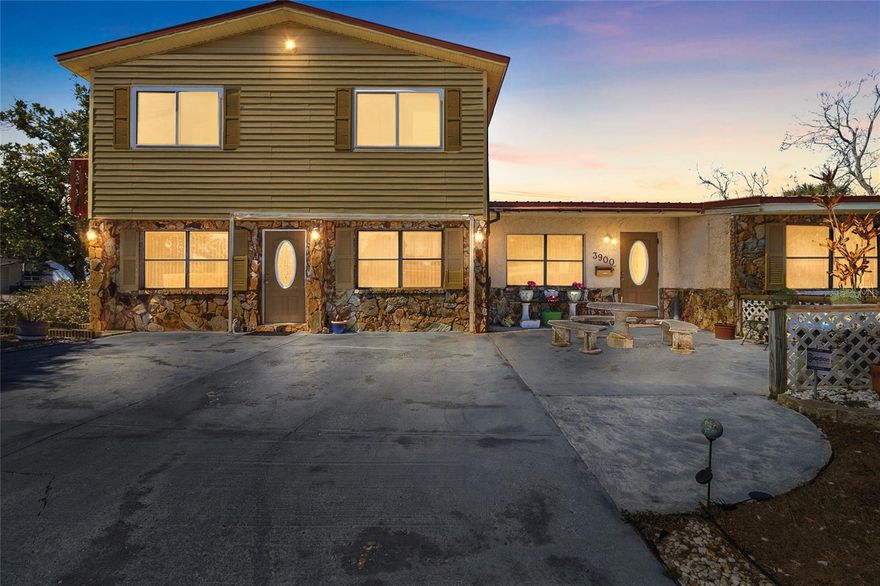 2,744 square foot, 4 bed, 2 bath, pool home sitting high and dry in flood zone X.   Not a flip, but a home that has been lovingly cared for by the same family for generations.  The kitchen opens to a covered deck area leading out to the in-ground pool or go straight from the primary bedroom out to the pool.  Lots of storage in the inside washer/ Dryer/ walk in pantry area with separate freezer. Massive 24 x 16 living room with access to the 754 square foot in-law apartment complete with it's own bedroom, kitchen and living room. Long lasting metal roof, two separate AC systems and plenty of storage in the two separate storage sheds all set on a big corner lot stretching 130 feet and ample parking for 4 cars and a lot more.