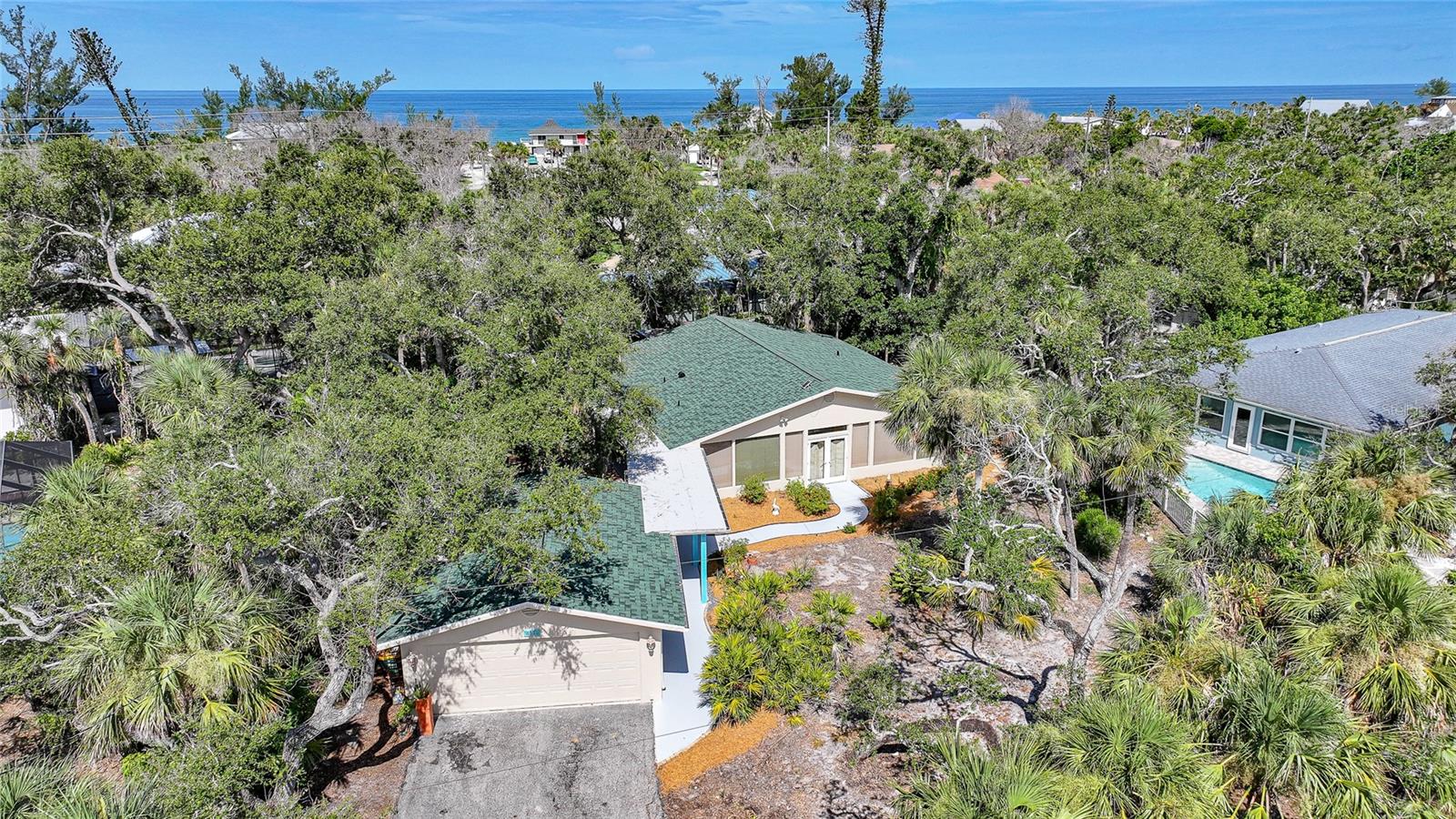 Coastal Luxury with Old Florida charm, Deeded Gulf & Bay Access on Manasota Key with No Flood or Hurricane Damage.
Welcome to Bay Oaks Circle an exclusive enclave on Manasota Key where charm, privacy, and coastal living converge. This beautifully maintained 2 bedroom + Bonus Room, 2-bathroom furnished home is nestled on an oversized .31 acre lot in the sought after Bay Oaks community, just steps from both deeded beach access to the Gulf and deeded Bay access for kayaking or paddleboarding.
NO storm or flood damage from Hurricanes Helene or Milton offering peace of mind and lasting value.
Step inside and feel the calm coastal energy throughout this move in ready home. The spacious split-bedroom floorplan is perfect for entertaining and everyday comfort. A freshly painted exterior (July 2025), New Roof (9/2024), Irrigation on well water and New Water Heater (2018), Garage Door (2017), AC (2014) and lush tropical landscaping provide exceptional curb appeal.
The chef inspired kitchen features granite tile countertops, an eat-at island breakfast bar, and generous cabinet storage. Natural light floods the home through pocketing glass sliders, creating a seamless connection between the expansive enclosed front porch and your private back patio retreat.
The primary suite offers a private sanctuary and a spa-style bathroom with a large walk-in shower—perfect for unwinding after a day at the beach.
Additional features include:
A detached garage with dedicated workshop and laundry room.
Low-maintenance landscaping with mature tropical foliage.
Plenty of room to expand your outdoor oasis.
Location perks: Bay Oaks is a quiet, tree-canopied neighborhood with easy access to Englewood Beach, where you’ll find daily morning yoga, charming island restaurants, and unforgettable sunsets. Optional HOA.
This is more than a home—it’s your gateway to an authentic Gulf Coast lifestyle. Whether you’re seeking a seasonal escape, full-time residence, or investment opportunity, this home checks every box.