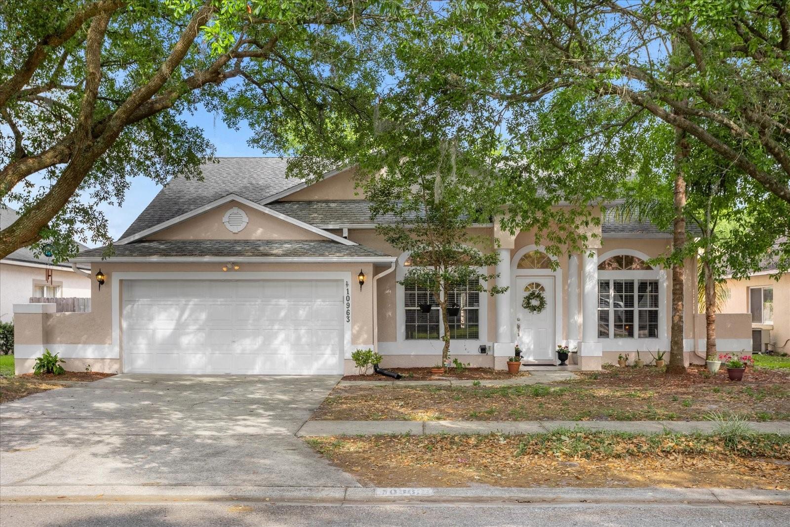Location! Location! Location! This Lovely 3 bedroom, 2 bath home with an OPEN FLOOR PLAN is located in an incredibly LOW HOA area, only 2.5 miles from UCF, close to Siemens, Research Park, Orlando International Airport, Waterford Lakes Town Center, as well as 417 and Highway 50. A NEW ROOF WILL BE IN BEFORE THE CLOSING DATE (The buyer will be able to choose the color). If you loved everything until here, wait until you enter this home and feel captivated by the architectural design touches, natural light, high ceilings, and vinyl and tile floors throughout. The formal dining room and living room area are perfect for entertaining. The kitchen features granite countertops, stainless appliances, and a huge wrap-around breakfast bar with bar stool seating for casual dining, overlooking a spacious family room with a walk-out to the backyard with a screened lanai for outdoor entertaining. The master suite is located on one side of the home and the other two guest bedrooms are on the other side, ensuring lots of privacy. The master retreat includes a walk-in closet, dual sinks, a large soaking tub, and a separate walk-in shower. Run to this one before it is gone!