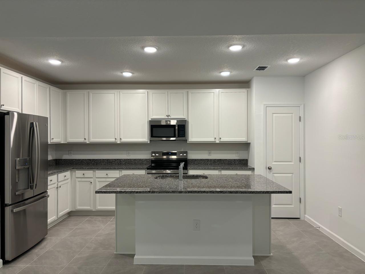 4 Bed 3 Bath Home with In-Law Quarters, largest home in Marion Oaks, beautifully finished and all top quality for your pickiest clients! Amazing opportunity to rent a never occupied brand new home! This 4 bedroom 3 bathroom home features a 1 Bedroom 1 Bathroom In-Law Quarters with it's separate entrance, living room space and a kitchenette, this setting is perfect for a large family or can also be used as an office space for the work at home individuals that need that separated area.
Main home has a large Master bedroom with it's nicely sized walk-in closet and Master bathroom; the other 2 bedrooms in the main house are also nicely sized and they share the second bathroom. Home has never been occupied and it's waiting for a new family to move in and make it it's own.
It features an open and bright layout with brand new Stainless Steel appliances, granite countertops and a beautiful center island perfect to entertain friends. It's large 2 car garage (1 garage opener) is perfect for storing more than just cars and the separate Laundry room makes doing laundry so much nicer!
House is conveniently located close to I-75, Orlando and Tampa are about 1 hour away and Gainesville about 35 min. The World Equestrian Center is about 25 min away.