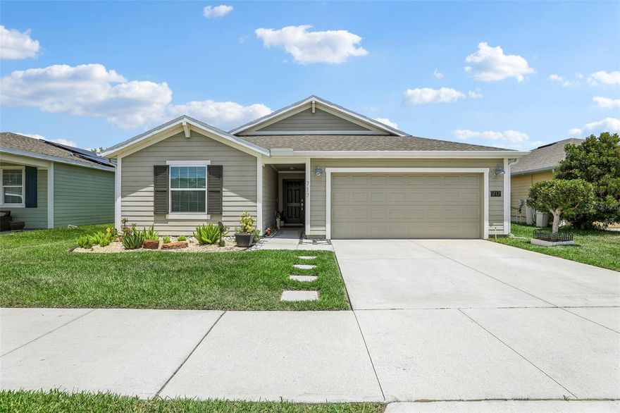 Welcome to this BEAUTIFULLY MAINTAINED 4-bedroom, 2-bath home in the desirable Estates at Lake Hammock community in Haines City, where modern comfort, SCENIC WATER VIEWS, and thoughtful upgrades come together to create the perfect Florida retreat. Built in 2020 and offering over 1,800 SQUARE FEET, this home still feels fresh and new while providing the benefits of an established, WELCOMING NEIGHBORHOOD. Step inside to discover a bright OPEN-CONCEPT LAYOUT where the Living Room, Dining area, and Kitchen flow seamlessly together, creating an inviting space ideal for both everyday living and entertaining. CERAMIC TILE FLOORING throughout the main living areas adds style and easy maintenance, while large sliding glass doors in the Living Room lead to the backyard patio and showcase PEACEFUL POND VIEWS with NO REAR NEIGHBORS. The beautiful backyard is FULLY FENCED and backs to tranquil water views, offering a relaxing outdoor setting to enjoy morning coffee or evening sunsets. Just beyond the home, a WALKING PATH leads to a community pier on the lake, adding to the peaceful atmosphere and outdoor lifestyle this community offers. The Kitchen is both stylish and functional, featuring an abundance of white cabinetry with UNDER-CABINET LIGHTING, solid surface countertops, stainless steel appliances, a closet pantry, UPGRADED FAUCET (2021), DESIGNER BACKSPLASH (2022), UPDATED LIGHTING (2023), and a spacious island with counter-height seating—perfect for gathering with family and friends. The nearby Dining area enjoys plenty of NATURAL LIGHT and scenic backyard views. The Primary Suite serves as a PEACEFUL RETREAT, complete with large windows overlooking the backyard and pond, a generous walk-in closet, and a SPACIOUS EN SUITE BATH featuring dual sinks with UPGRADED FAUCETS (2021), a step-in shower, and a private water closet. THREE ADDITIONAL BEDROOMS and another full bath provide flexibility for family, guests, a home office, or creative space. A Laundry Room just off the Kitchen, is complete with washer, dryer, and storage shelving, adding everyday convenience. ADDITIONAL UPGRADES and features include NEW CEILING FANS (2023), ROOF GUTTERS (2020), SOLAR ELECTRIC SYSTEM (2020), RING ALARM SYSTEM on doors and windows (2020), an AMERICAN HOME SHIELD WARRANTY PLAN, and a BUILT-IN PEST CONTROL SYSTEM, offering both comfort and peace of mind. Residents of Estates at Lake Hammock enjoy amenities including a COMMUNITY PARK and PLAYGROUND, all within a peaceful setting surrounded by natural beauty. Conveniently located in Haines City, the home offers EASY ACCESS to shopping, dining, golf courses, and outdoor recreation. NEARBY ATTRACTIONS include Lake Eva Community Park, local wineries, scenic lakes, and championship golf courses. Plus, you’re only about 30 minutes from WALT DISNEY WORLD RESORT, making world-famous entertainment, dining, and attractions easily accessible. With its modern design, PEACEFUL POND VIEWS, energy-efficient upgrades, and MOVE-IN READY condition, this Estates at Lake Hammock home provides the perfect combination of comfort, convenience, and RELAXED FLORIDA LIVING. Call and schedule your tour today!