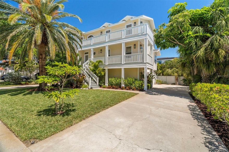 HUGE PRICE IMPROVEMENT! Pasadena Yacht & Country Club’s Hole-in-One! If you’re looking to elevate your lifestyle through community, amenities, and ensured safety for your family look no further than this Key West Style Home! Nestled within the exclusive royal palm-lined community of Kipps Colony Estates in the gated Pasadena Yacht & Country Club, this stunning home underwent a custom renovation in 2021, marrying modern elegance with comfortable living. Mature landscaping on all sides of this two-story elevated home creates the feeling of a private tropical treehouse, and the adjacent pond with active water fountains further elevates the ambiance while increasing privacy. Notably, this home experienced zero flood damage from Hurricanes Helene and Milton! As you step through the front door, you're greeted by a grand foyer with a two-story ceiling, adorned with skylights and expansive windows that flood the home with natural light. The custom woodwork in the entryway sets the tone, beautifully mirrored across to the woodwork and marble-faced fireplace in the living room. The newly renovated kitchen is a custom haven for culinary enthusiasts. Featuring soaring 20’ ceilings and large windows, it flows seamlessly into the dining room and connects to the second-story catwalk above. Luxurious Dolomite stone countertops and an expansive island offer both beauty and practical storage solutions. A custom cabinet reveals a spacious walk-in pantry. The open floor plan is elegant and versatile allowing the kitchen, dining, and living rooms to integrate smoothly, creating an inviting environment for entertaining. Adjacent to the kitchen are glass French doors leading to a flexible space. This suite includes a stunning bathroom with a double marble vanity, bathtub, shower, and vertical laundry, nestled amid custom cabinetry. Ascending the stairway, you'll discover the top floor master suite, embodying luxury with a vaulted ceiling, expansive windows, and a balcony with views of Boca Ciega Bay. The master bath is a serene retreat featuring a double marble vanity, marble floors, and walk-in closet. Soak in the massive tub with elegant marble detailing, or refresh in the separate marble shower. Two additional bedrooms on this level share a beautifully crafted bathroom, adorned with elegant cabinetry and a marble-inlaid tile shower/tub. One bedroom even boasts its own balcony. Step outside to the outdoor oasis, with lushly landscaped backyard, a private haven which boasts a pool and spa. Mature tropical foliage ensures privacy, making this retreat an entertainer’s dream. A spacious covered patio offers ample space for outdoor dining or relaxing by the pool. The ground floor features a bonus air conditioned room with sliding door access to the pool, multiple storage rooms, and both a double and single garage, accessed by two separate driveways. Enjoy the array of luxurious amenities this community offers, including a championship golf course, first-class restaurant, a marina, clubhouse with pool and gym, and courts for tennis and pickleball. Golf enthusiasts: you can skip the multi year waitlist at PYCC if you sign up within 30 days of closing on home! Don’t miss the chance to own a move-in ready home in one of the most desirable, family-friendly neighborhoods—where comfort, convenience, and community come together effortlessly.