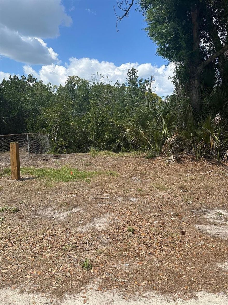 Tucked along a quiet canal in Nokomis, this rare boat slip opportunity offers a uniquely natural setting for those who appreciate Old Florida charm. Offering approximately 450 square feet with 15 feet of water frontage, the property is wooded, unimproved, and beautifully rustic—creating a peaceful, unspoiled connection to the water. With direct access to Shakett Creek, enjoy a scenic route to the Intracoastal and beyond, ideal for launching kayaks or small boats for a day on the water. Adjacent to a county-owned park, the setting feels private and surrounded by natural vegetation and tranquil views. This is not a buildable site and is intended for water access and recreational use only. May be purchased in conjunction with 701 Frances Street, offering a unique opportunity to pair nearby property ownership with your own private launch point.