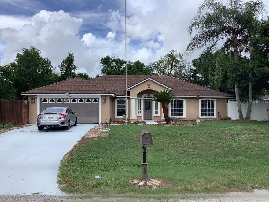 Beautiful 3-bedroom, 2-bath home situated in Deltona Lakes. This residence boasts a formal living room, a formal dining room, and a spacious family room that looks out over the kitchen. The home features elegant travertine flooring throughout and is painted in a soothing neutral palette. The rooms are generously sized, and the split floorplan offers ample privacy. From the kitchen, step through the glass sliding doors into a fenced backyard complete with a deck, providing plenty of space for entertaining. Adjacent to the home, you'll find a cozy little sitting area nestled among the trees, ideal for enjoying a cup of coffee or having a lovely evening with loved ones. Deltona is conveniently located between Orlando and Daytona beaches, with shopping and dining options just a short distance away. Contact us today for a private tour!
