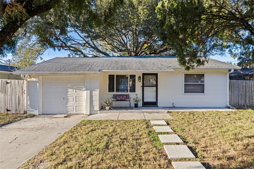 Move-in ready and priced to sell, this home is an ideal opportunity for buyers ready to take the next step into homeownership. This turn-key home offers an open, functional layout that works well for everyday living. The living room flows into the renovated kitchen with updated appliances, while the dining space overlooks the backyard and offers nice natural light. Enjoy the screened-in patio for relaxing, along with a garage for parking and additional storage. The fully fenced backyard is spacious and private, with plenty of room for a pool, entertaining, or future outdoor improvements. The home experienced no flooding or hurricane damage and includes a $1,855 transferable flood insurance policy. Located in a safe, established St. Petersburg neighborhood, it’s just minutes from downtown St. Pete, 4th Street dining and shopping, and offers a quick I-275 commute to Tampa.