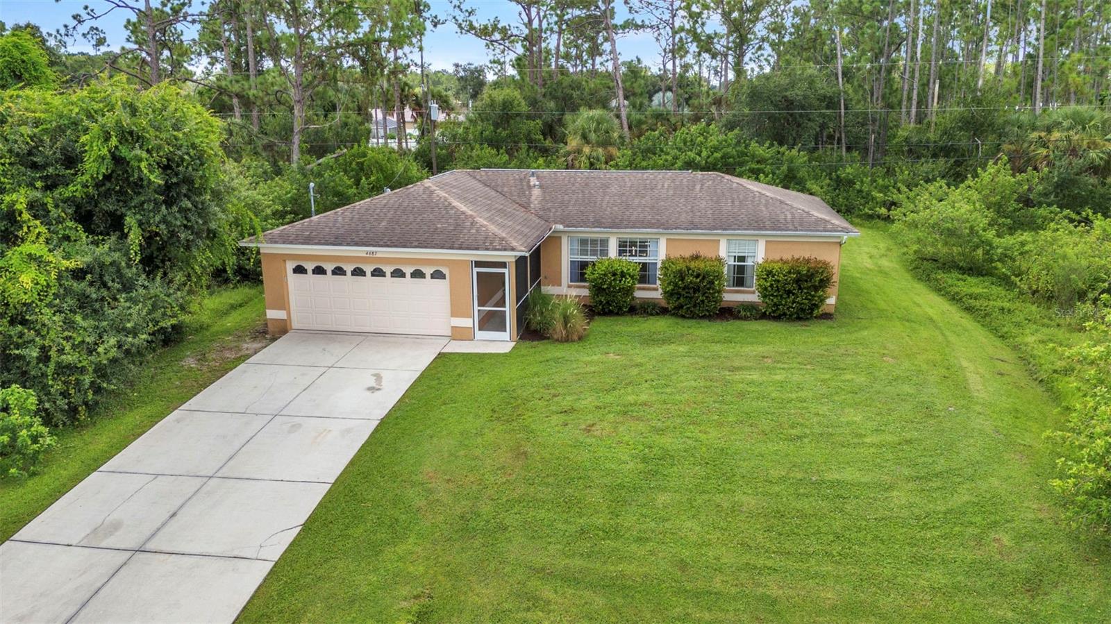 Welcome to Sunburst Ave– a beautifully maintained home perfectly situated for both comfort and convenience.
Step inside to find fresh paint, wood plank flooring, and a bright, clean feel that instantly makes you feel at home. This property has been lovingly cared for and is ready for its next family to create lasting memories. Set high and dry, with no flood zone concerns and no neighbors on either side or behind, you’ll enjoy privacy and peace of mind.
A Day in the Life Here: Wake up to quiet mornings surrounded by nature, sipping coffee at your covered outdoor table. Children can laugh and play on the swing set while evenings are best spent gathered around the fire pit, enjoying crisp Florida nights under the stars. Inside, the open and well-kept interior offers a comfortable retreat after a day of adventure.
Location Highlights:
I-75 Access: Just 8 minutes away – making commuting or trips to Sarasota, Venice, or Fort Myers effortless.
Publix Supermarket: 6 minutes away – everyday errands made simple.
Manasota Key Beach: Only 25 minutes – spend your weekends with toes in the sand, watching sunsets over the Gulf.
Why You’ll Love It. This isn’t just a house; it’s a lifestyle. Imagine a home that offers serenity, space, and connection – where evenings are spent outdoors with family, weekends are for the beach, and weekdays are made easy with quick access to shopping and highways. This well-maintained, move-in ready property is waiting for the next family to cherish it, just as the current owners have.