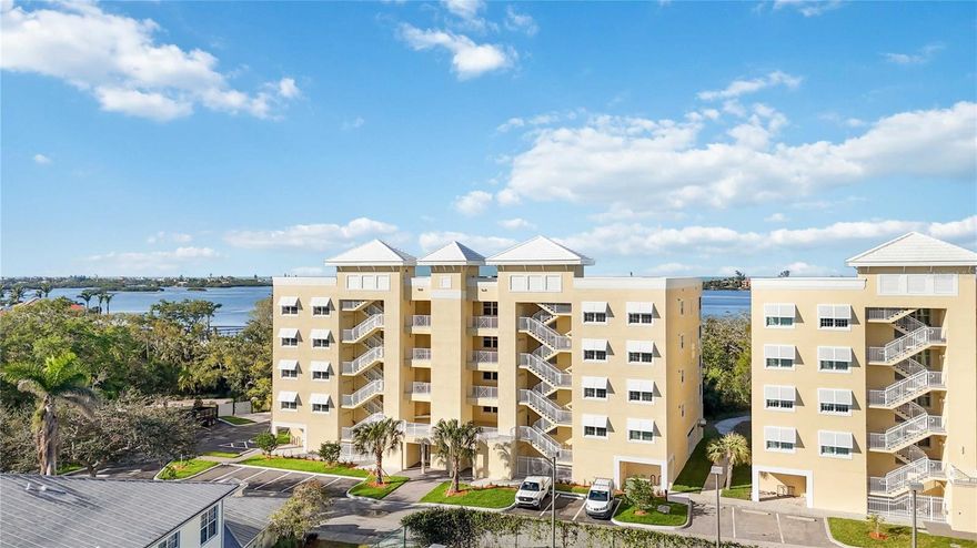 READY FOR IMMEDIATE OCCUPANCY!
Modern Elegance at Edgewater: A Luxurious Haven Overlooking Little Sarasota Bay

Step into a world of contemporary sophistication with this new construction condominium nestled in the eminent enclave of Edgewater at Hidden Bay. Boasting 1937 square feet, this meticulously crafted residence offers three bedrooms, two bathrooms, and an inviting office space for your creative pursuits.

The allure begins in the heart of the home – a sleek kitchen adorned with top-of-the-line LG appliances, complemented by solid wood cabinetry and exquisite quartz countertops that beckon culinary adventures. As natural light dances through expansive windows, partial views of tranquil Little Sarasota Bay create a serene backdrop to everyday living.

Indulge in comfort and style as you unwind in the spacious bedrooms or revel in the luxurious ambiance of beautifully appointed bathrooms. Every detail has been thoughtfully considered to elevate your lifestyle, from high-quality finishes to seamless design elements that exude modern charm.

Edgewater's coveted location offers more than just a place to call home; it provides a gateway to upscale living near waterways and green spaces. Embrace a life where convenience meets luxury – where every day is an opportunity for relaxation and rejuvenation amidst breathtaking surroundings.

Discover unparalleled tranquility and refinement at Edgewater