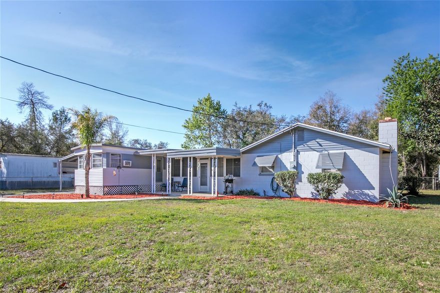 MOTIVATED SELLER .....This house has 3 bedrooms and 2 full baths with a study/den. 1800 Square feet. There are many possibilities for this house. The house has two separate living areas attached by a common enclosed atrium area. The property has been well maintained and is immaculate. Just some of the upgrades include well pump and pressure tank (2019), septic (2022), electric panel 200amp service(2022), roof(2017), tie downs have been updated,  lightning protection, new luxury vinyl plank flooring and carpet throughout, plumbing is copper and cpvc, new blinds throughout, new hot water tank, freshly painted inside and outside. The connecting atrium is 22x24 with lots of windows for natural light. The primary bedroom has a wood burning brick fireplace and the primary bath has a new shower, vanity, sink and flooring. There is a large carport, 2 sheds in the back for storage and the property is totally fenced with a chain link fence.  Washer, dryer, furniture and swing set all convey.  This home is move in ready.  Schedule your appointment to see today.