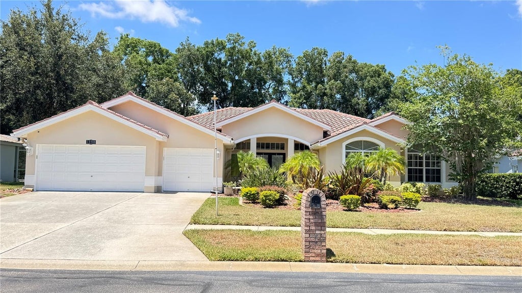 Photo of 1230 Berkshire Lane, Tarpon Springs, FL 34688 (MLS # O6419298)