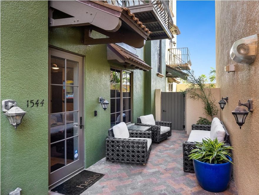 Enjoy downtown living to the fullest! Exquisite finishes in a secure boutique development of only 22 luxurious townhouses. Situated in the quiet part of downtown yet with a 92/100 Walk Score. On the sought-after and private upper courtyard level, lush landscaping and a charming patio welcome you home. Inside, an open floorplan with private elevator, high ceilings, travertine floors, Andersen impact-rated windows and doors, cozy fireplace and a balcony overlooking Burns Lane make for a comfortable lifestyle. The custom kitchen boasts finely appointed cabinetry, granite countertops, Viking stainless-steel appliances and a pot filler over the 6-burner stove. The entire third floor is the spacious and peaceful owner’s retreat. The second floor features 2 bedrooms, one bath plus den. Your daily choices are endless: walk to historic Burns Court and Main Street’s restaurants, shopping, theaters, galleries, marina, and renowned Saturday Farmer’s Market; restore and relax on the amenities level with the heated pool and spa, and cozy fire-pit. An unparalleled lifestyle! 2017 A/C units, 2 deeded parking spaces plus storage unit, battery-operated solar shades.