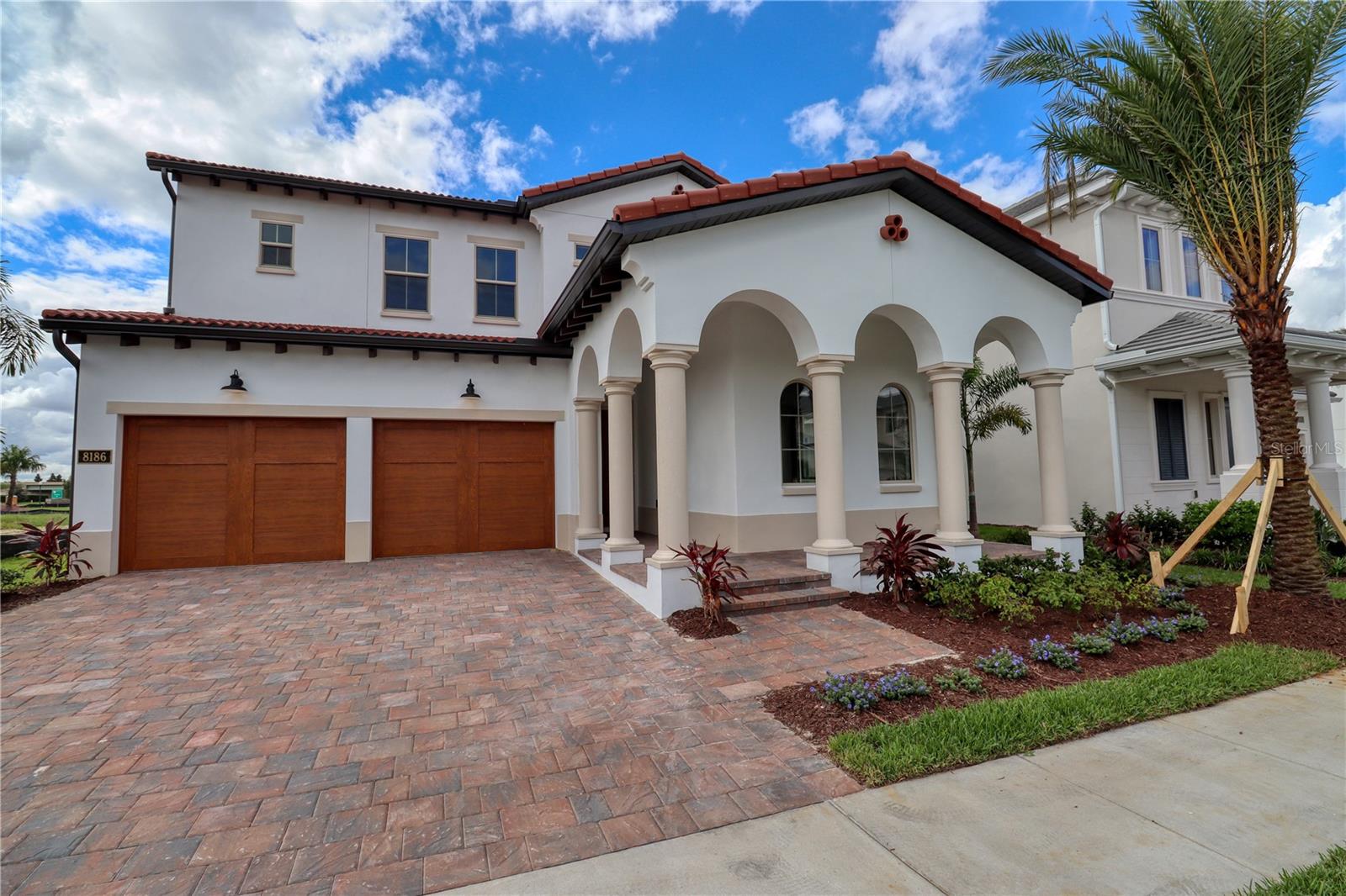 Welcome to this stunning home located in the desirable Lakeshore community! Featuring 5 bedrooms, 4.5 bathrooms, and a 3-car garage, this spacious Madeira model is designed for modern living.The open-concept layout seamlessly connects the great room, gourmet kitchen, casual dining area, and covered lanai—perfect for both everyday living and entertaining. A first-floor bedroom with a private bath provides comfort and flexibility for guests or multigenerational living.Upstairs, the bright loft leads to the expansive primary suite, secondary bedrooms, and additional bathrooms. Highlights include a covered entryway, an elegant dining room with coffered ceiling, Jack-and-Jill bathroom for secondary bedrooms, and a convenient upstairs laundry room.Enjoy the incredible lifestyle Lakeshore has to offer with abundant green spaces, a lakefront clubhouse with fitness center, resort-style pool, firepit, summer kitchen, playgrounds, hammocks, a club room, and access to kayaks & canoes on Panther Lake. This home is a must-see! ?