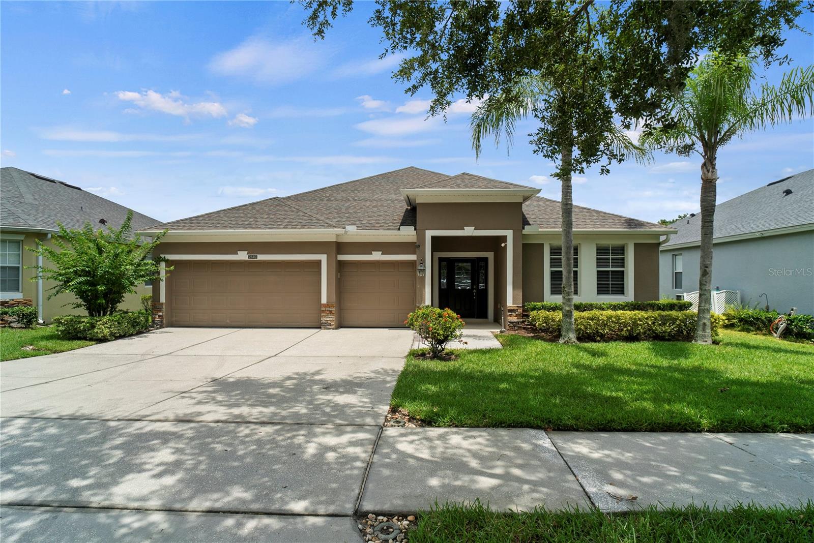 One or more photo(s) has been virtually staged. Welcome to life inside the sought-after Stoneybrook West community, a guard-gated neighborhood in the heart of Winter Garden offering an exceptional blend of privacy, comfort, and resort-style amenities. Imagine having nearly 3 acres in the middle of suburbia—a rare find that provides space to spread out while still enjoying all the conveniences of city living.
This thoughtfully designed home offers a versatile layout perfect for modern living. As you step through the front door, you're greeted by a welcoming foyer with a flex space to your left—ideal for a home office, gym, or playroom. Just a few steps further, the home opens into a formal living room on the right and a formal dining room on the left, creating a warm and inviting setting for gatherings.
The main living area features 5 solar tubes throughout that brings in natural light. Step outside through the sliding glass doors that lead to your covered screened lanai, where you can unwind while enjoying peaceful lake views. The kitchen is the heart of the home, offering granite countertops, 42-inch cabinets, and two solar tubes for a bright, airy feel.
Enjoy the functionality of a split floor plan—the primary bedroom is located on one side of the home with a generous walk-in closet, while the opposite side features three additional bedrooms and two full bathrooms, thoughtfully separated for added privacy. One bedroom and bath are tucked away toward the back of the home—perfect for guests or multi-generational living.
Recent updates offer peace of mind, including a newer roof (2 years old), a water heater just 2 years old, and a new AC installed March 21, 2023. Additional highlights include a spacious laundry room with a basin tub and a large backyard with room to roam and relax.
As a resident of Stoneybrook West, you’ll have access to an incredible list of resort-style amenities: Sparkling community pool, Basketball and tennis courts, Community dock—ideal for fishing or simply taking in the serene lake views and Scenic walking paths, playgrounds, and peaceful green spaces.
Don’t miss this opportunity to own a home with the unique feel of country living on 3 acres in the heart of suburbia, while being just minutes from shopping, dining, top-rated schools, and the charm of historic downtown Winter Garden. Schedule your private showing today and discover the lifestyle you’ve been waiting for!