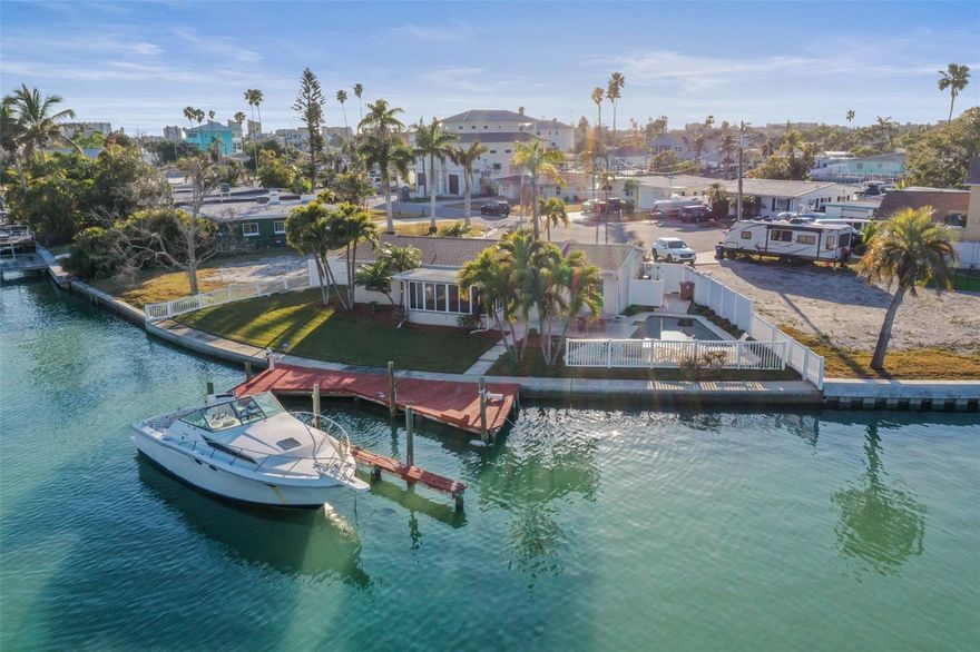 Boater’s Dream! 118’+ Waterfront Paradise on one and one half Lots! Wake up dolphins and plentiful marine life swimming by. Live the ultimate Florida Lifestyle! This rare 9,880 sq. ft. property offers an incredible 118 feet of water frontage on a 1.5-lot parcel, providing unmatched privacy and space. Featuring a sea wall and wrap-around deck and dock, this is a deep-water dream designed for large powerboats or sailboats with immediate, open access to both the Intracoastal Waterway and the Gulf. Relax in your private oasis featuring a stunning inground heated and cooled pool (with a new 2024 pump) plus an outdoor shower. Walk to nearby sandy beaches, top-tier restaurants, and premier shopping at John pass, this is the perfect site to build your dream family home for primary or 2nd home use. Existing home is partially remediated, boasts 3 bedrooms and 3 baths with exquisite water views. Hot water Tank 2024, A/C 2023, Roof 2016, Side Fence 2025. Bring your builder and design a custom dream home on this unique oversized gorgeous lot.