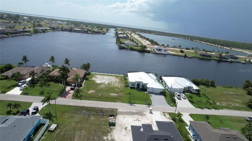 Beautiful Waterfront Gulf access Lot NO BRIDGES near 7 Island Project , Sunset views like you have never seen see pictures from neighbors. Street is among new homes. Seawall and Doc installed 2024 land has been cleared. Ready to build your dream home on.